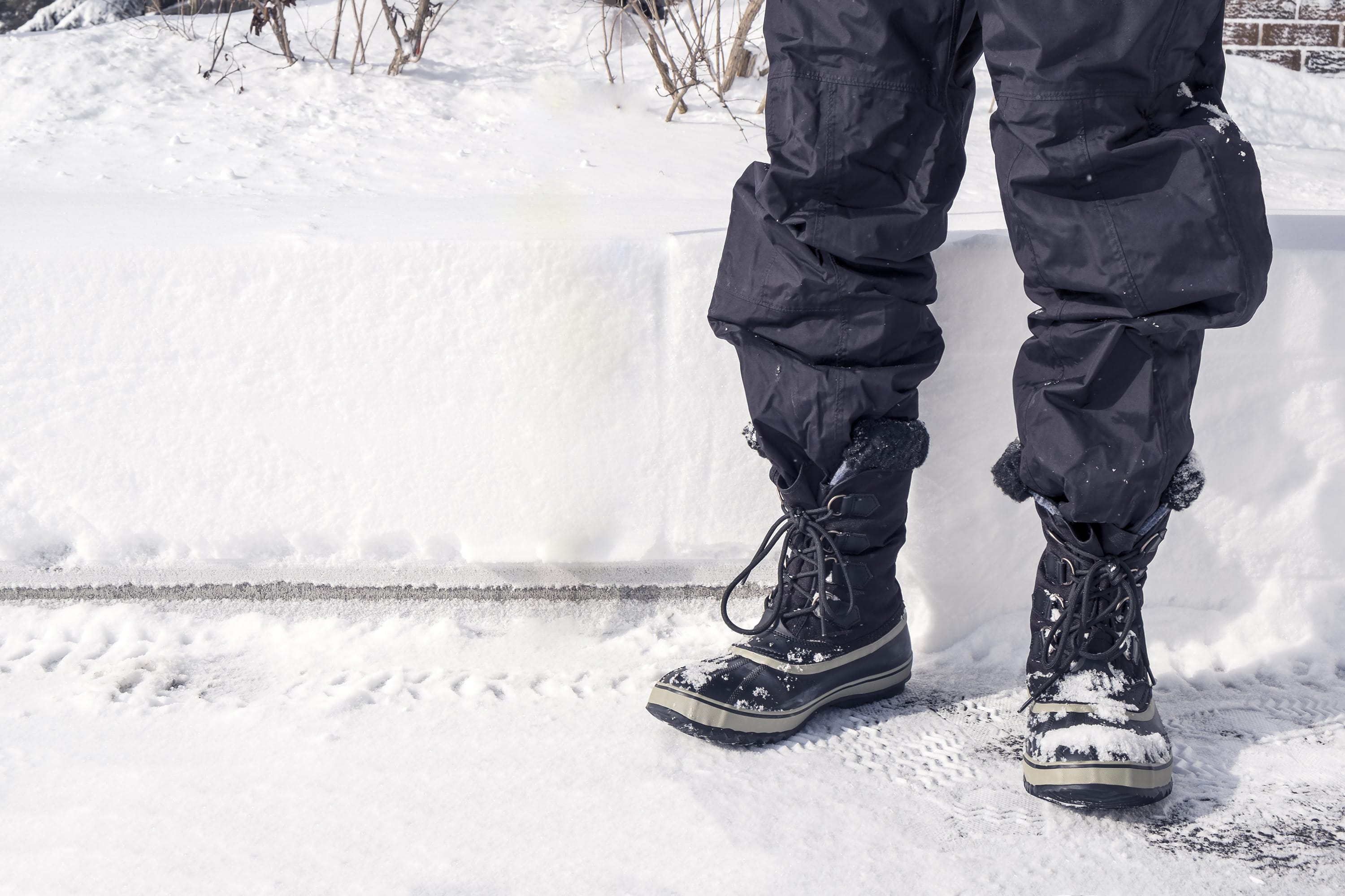 A grown-up in snow pants. (Shutterstock)