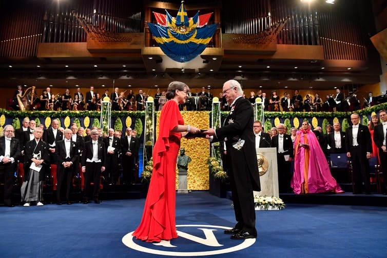 Physics laureate Donna Strickland receives the prize from King Carl Gustaf of Sweden during the Nobel Prize award ceremony in Stockholm on Dec. 10, 2018. (Pontus Lundahl/Pool Photo via AP)