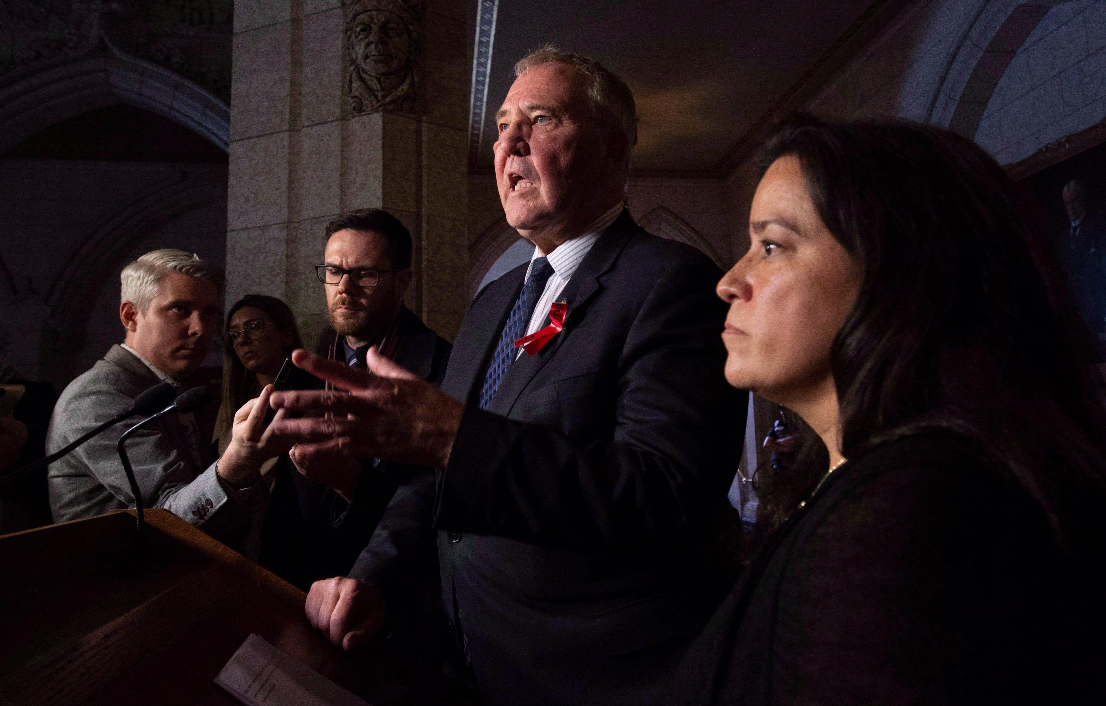 Wilson-Raybould looks on as Minister of Border Security and Organized Crime Reduction Bill Blair speaks at a news conference in Ottawa on Dec. 4, 2018. (THE CANADIAN PRESS/Adrian Wyld)