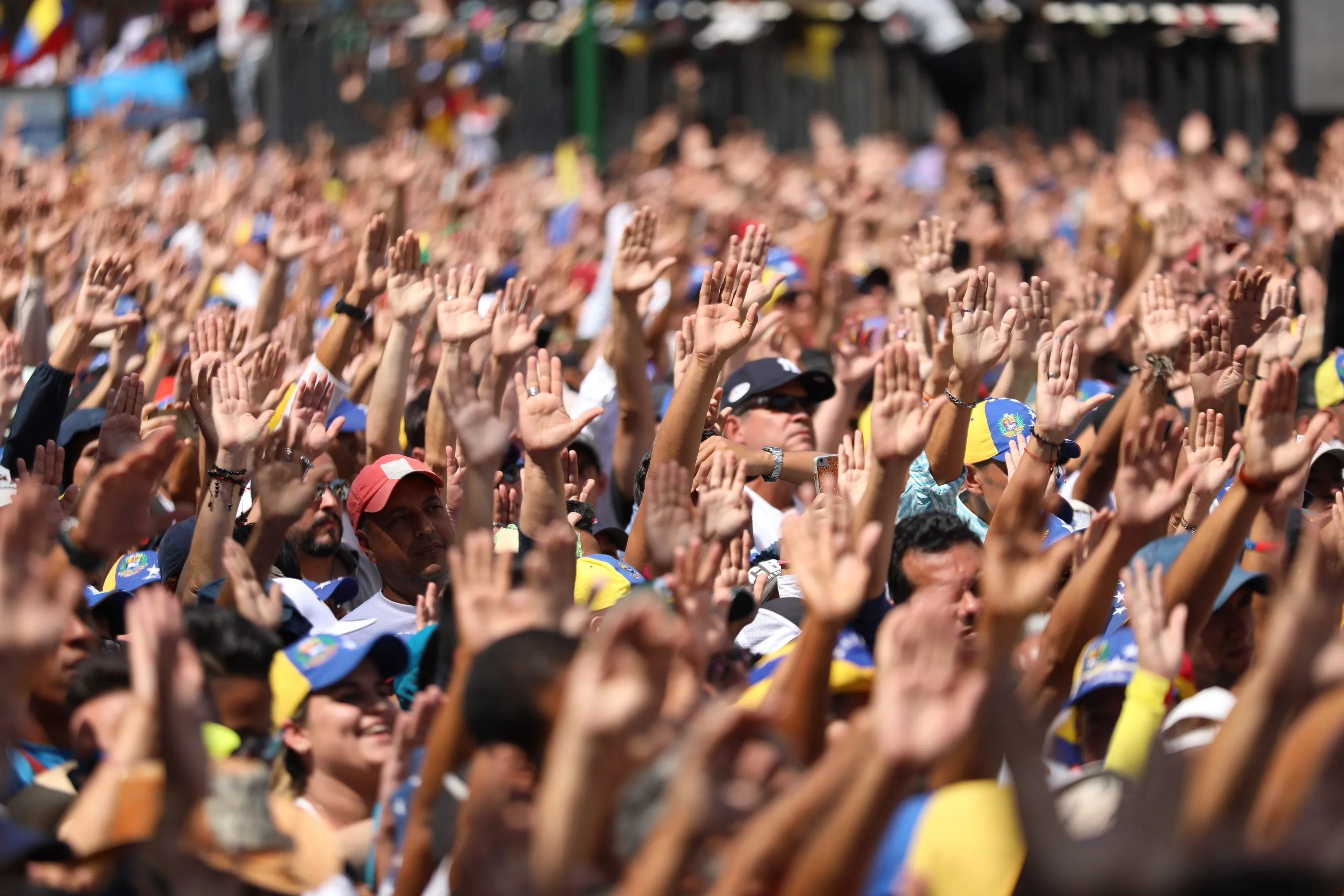 Supporters take an oath during the speech in Caracas by Juan Guaidó, who's been recognized by numerous countries, including Canada and the interim leader of Venezuela; Guaidó spoke during a march against the regime of Nicolas Maduro. (CP/EPA/Miguel Gutierrez)