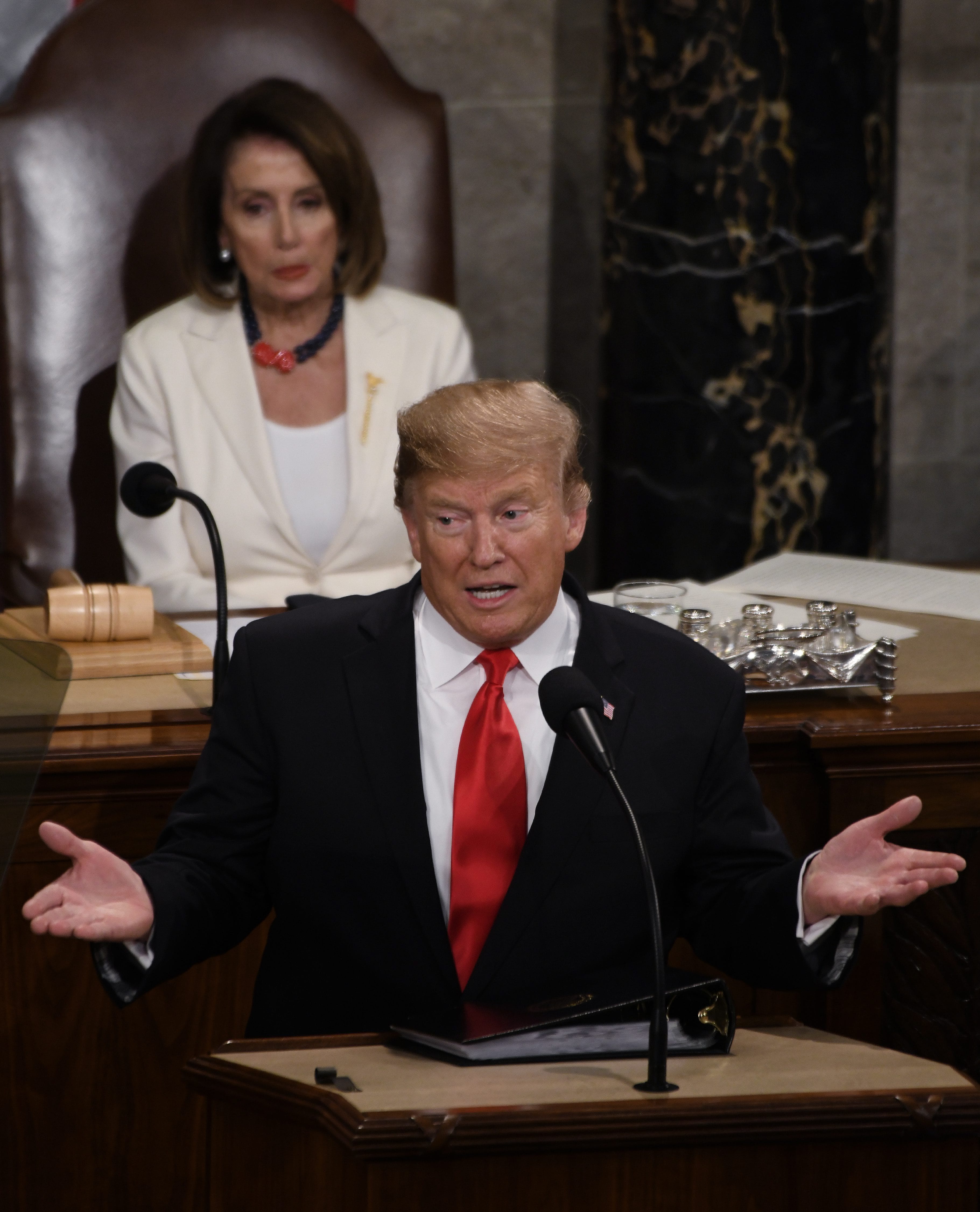 Trump delivers his State of the Union address on Tuesday, as House Speaker Nancy Pelosi looks on. (Photo by Olivier Douliery/ABACAPRESS.COM/ \via CP)