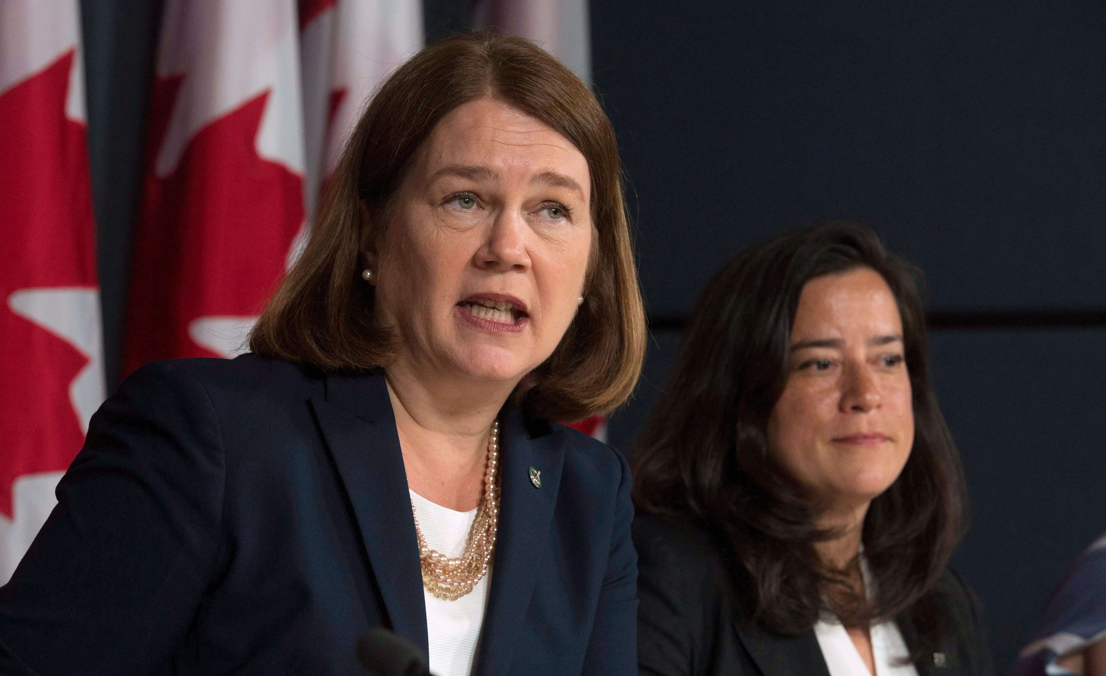 Philpott responds to a question as Wilson-Raybould looks on during a news conference in Ottawa on Thursday, June 30, 2016. (THE CANADIAN PRESS/Adrian Wyld)