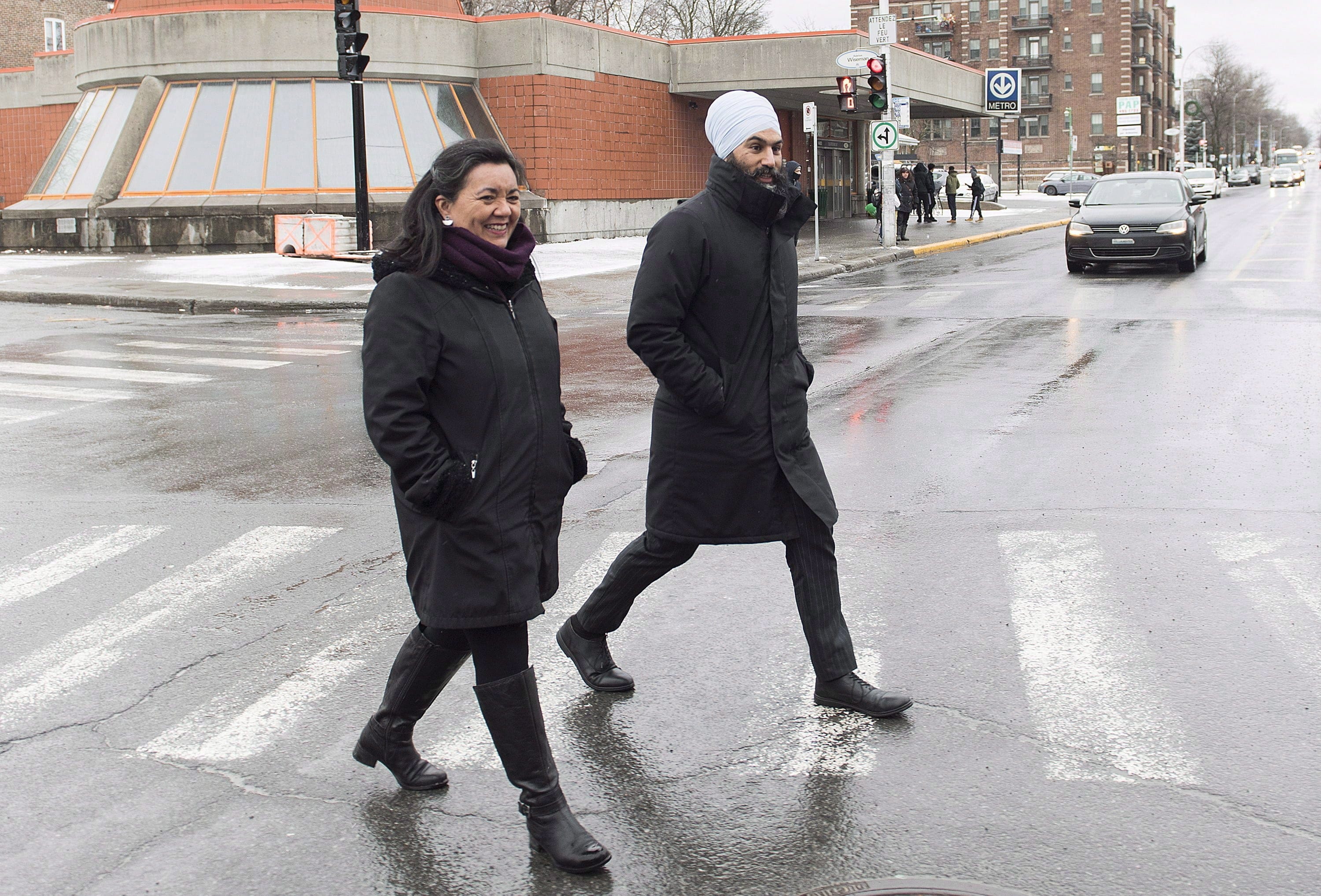 Singh and NDP candidate Julia Sanchez tour the Montreal borough of Outremont on Dec. 22, 2018. (THE CANADIAN PRESS/Graham Hughes)