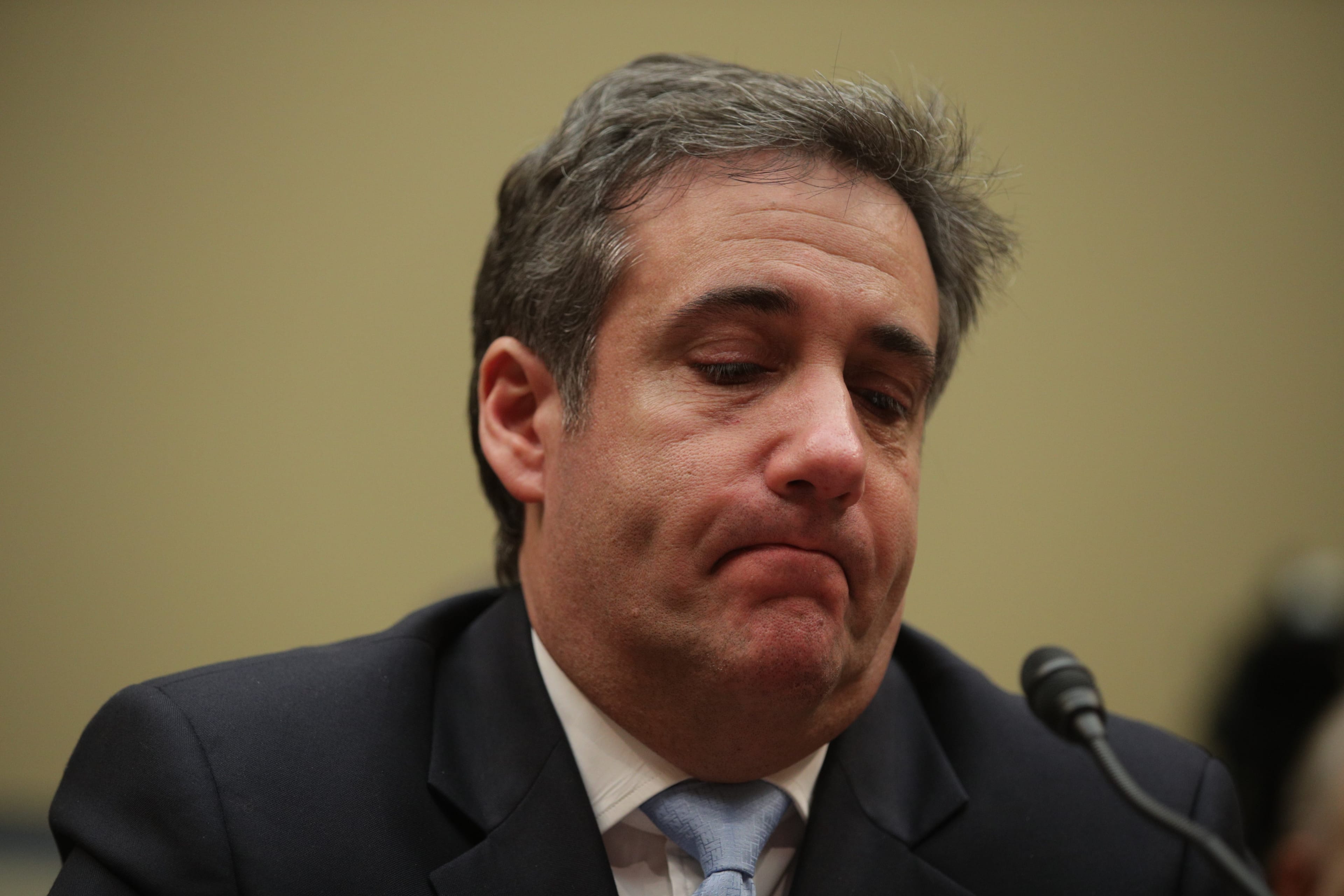 Michael Cohen, former attorney and fixer for President Donald Trump, gets emotional listening to Rep. Elijah Cummings (D-MD) give his closing statement after Cohen testified before the House Oversight Committee on Capitol Hill February 27, 2019 in Washington, D.C. (Photo by Alex Wong/Getty Images)