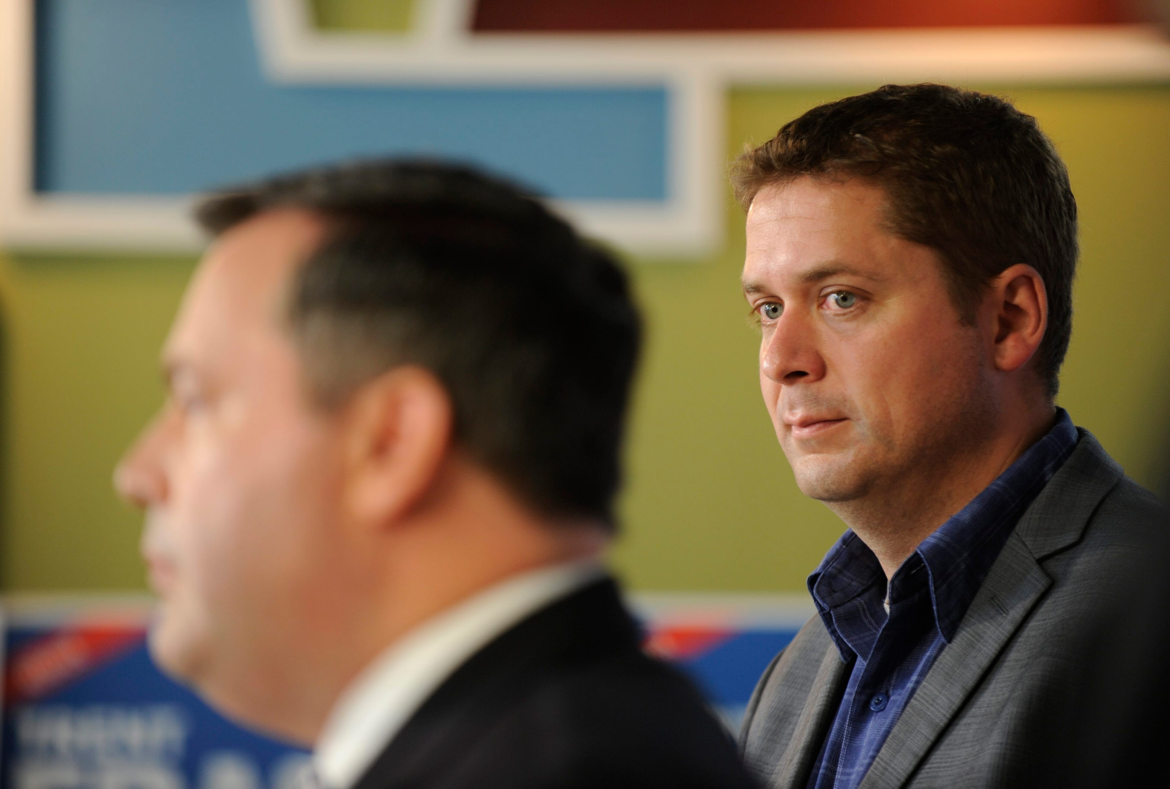 Scheer looks on as Kenney announces a campaign promise in Regina, on Saturday, Sept. 26, 2015. (THE CANADIAN PRESS/Mark Taylor)