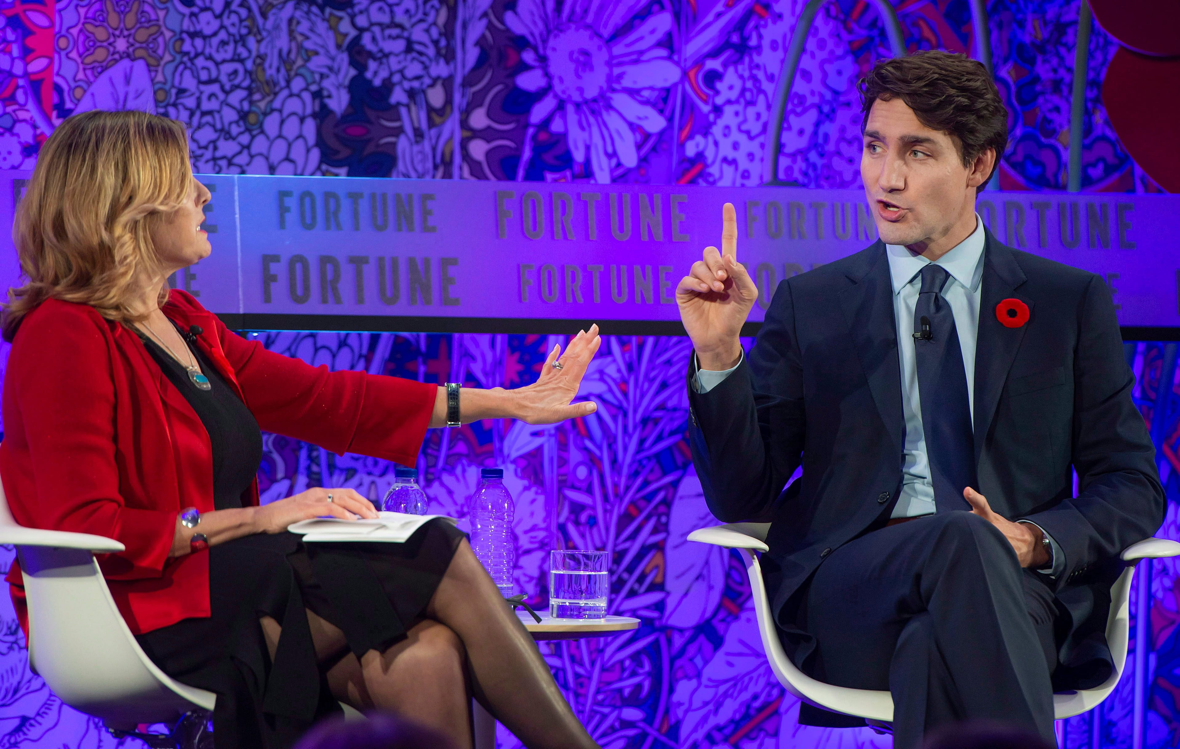 Trudeau speaks with Nina Easton, an American author, during the Fortune Most Powerful Women International Summit in Montreal on Monday, Nov. 5, 2018. (THE CANADIAN PRESS/Peter McCabe)