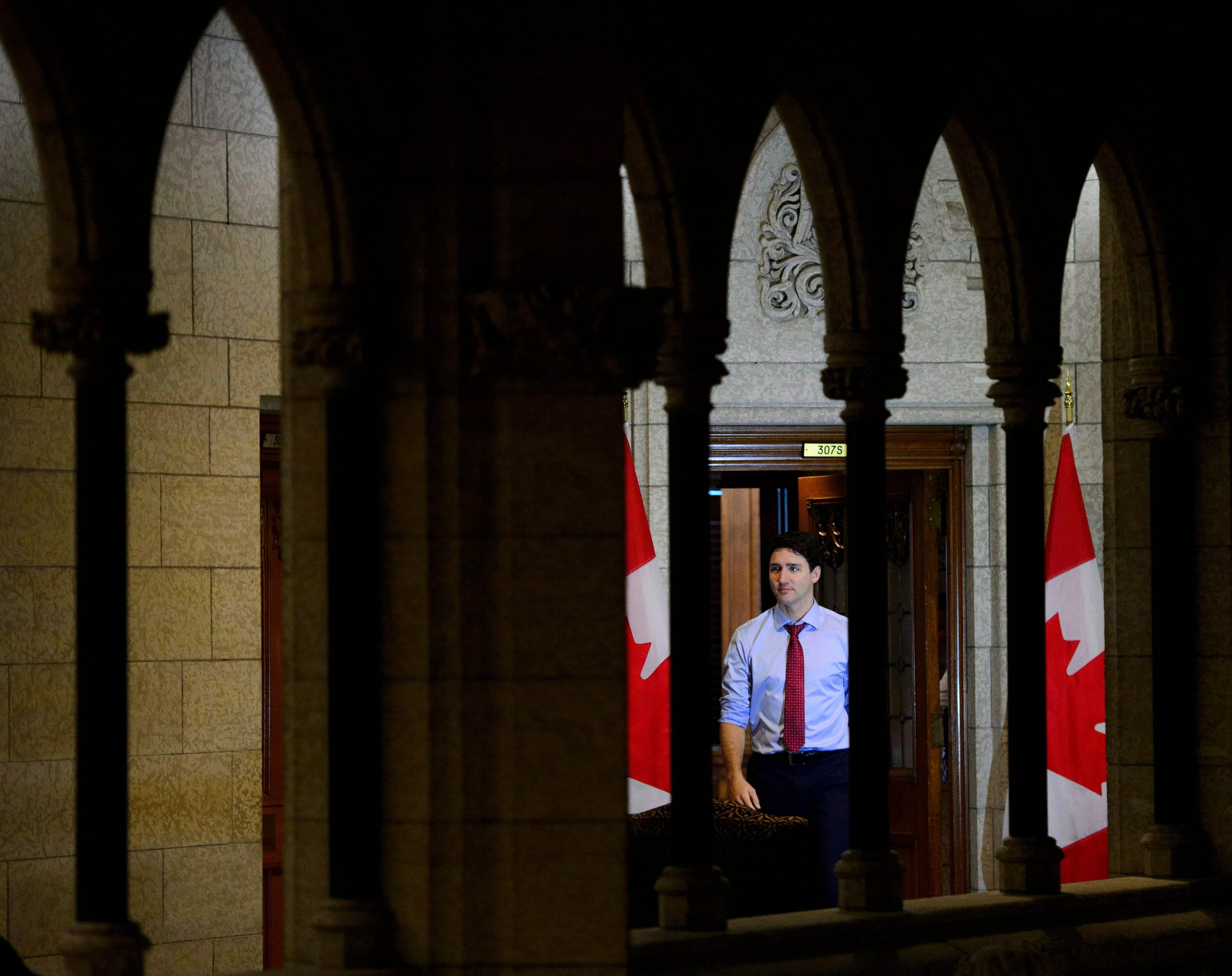 Trudeau makes his way from his office to take part in a year end interview with The Canadian Press on Parliament Hill in Ottawa on Friday, Dec. 14, 2018. (THE CANADIAN PRESS/Sean Kilpatrick)