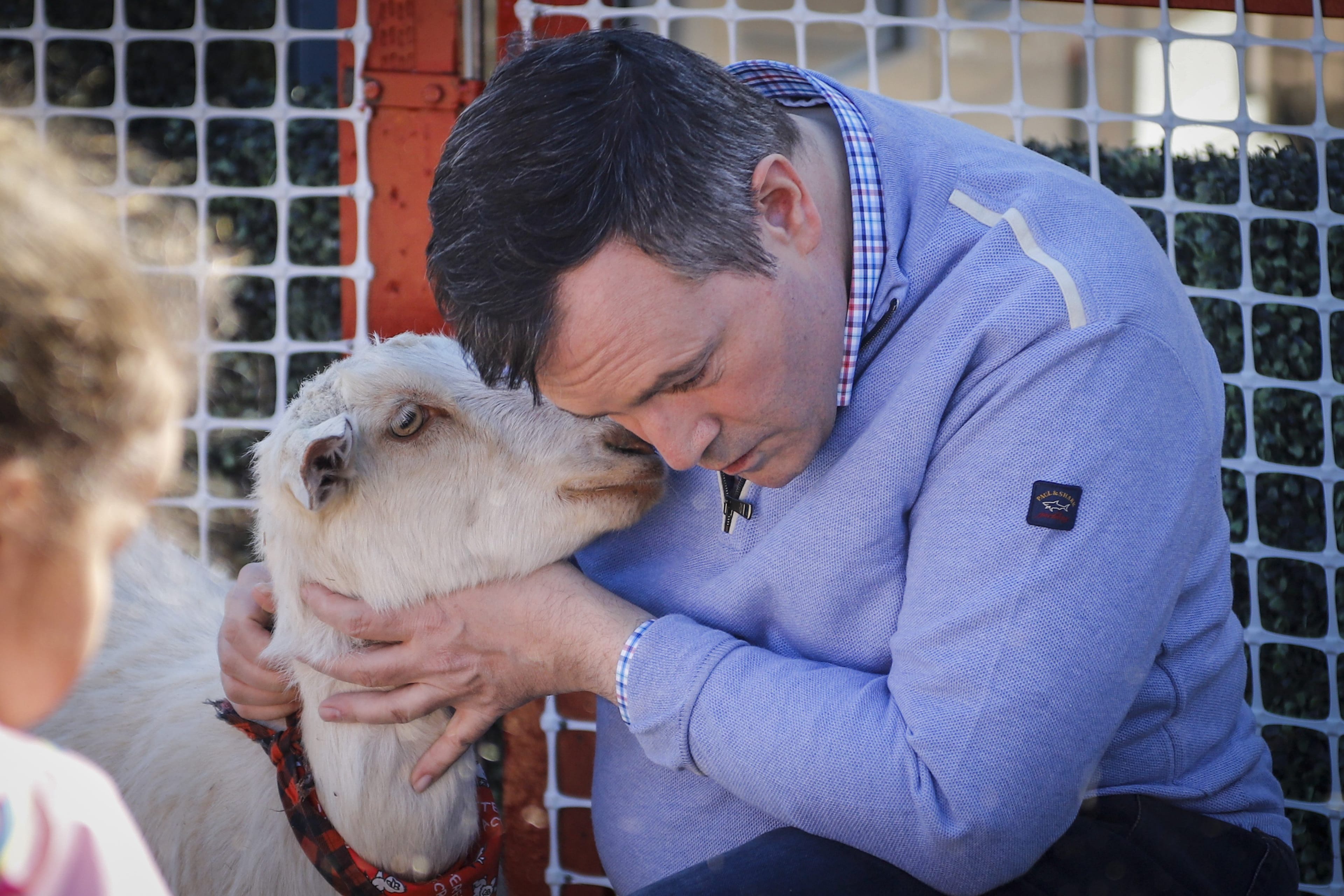 Kenney attempts to show his softer side, as polls suggest female voters are less likely than men to support him. (Jeff McIntosh/CP)
