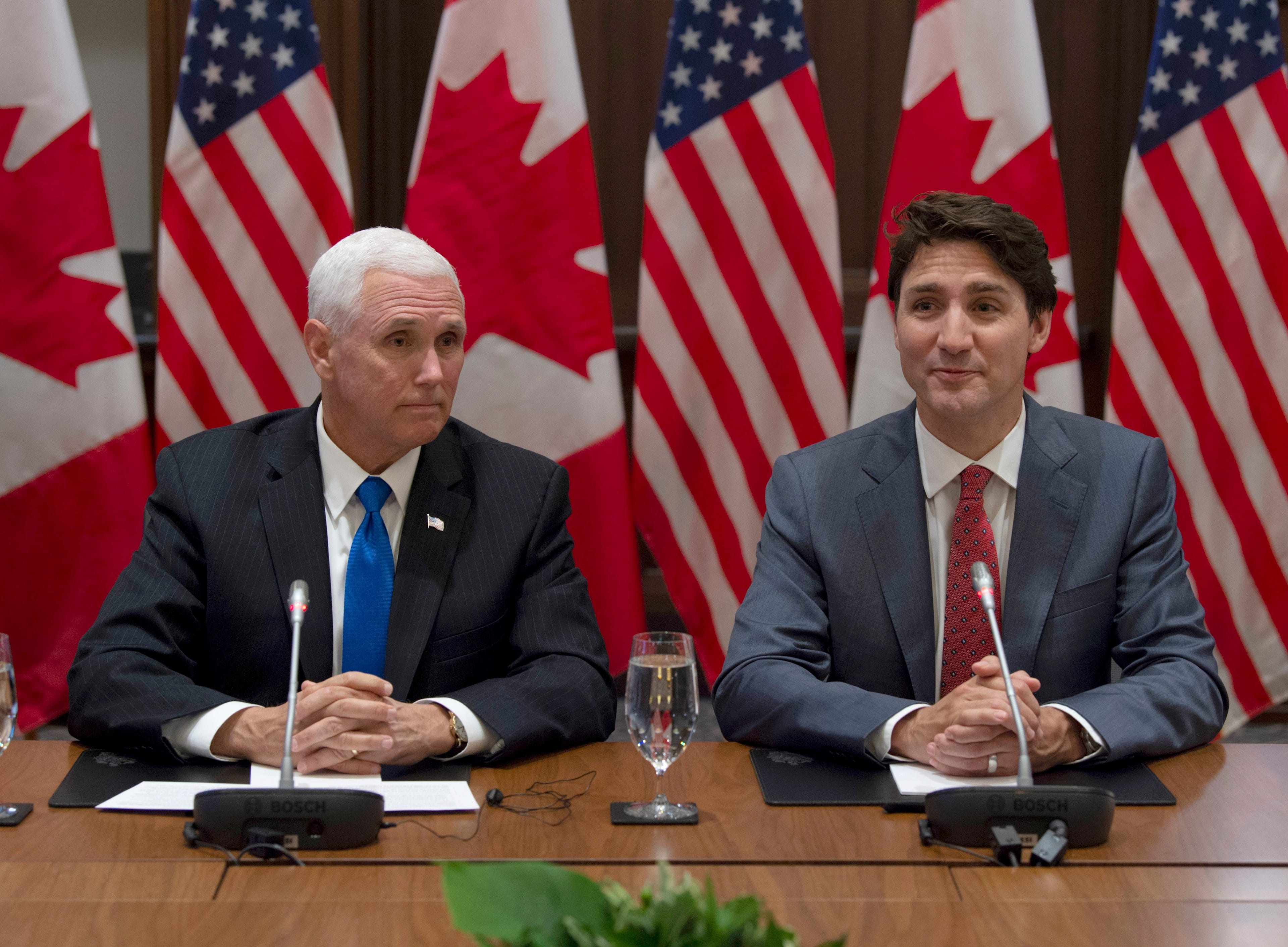 Trudeau and Pence wait for the Canadian Council for the USMCA meeting to begin on Parliament Hill on May 30, 2019. (Adrian Wyld/CP)