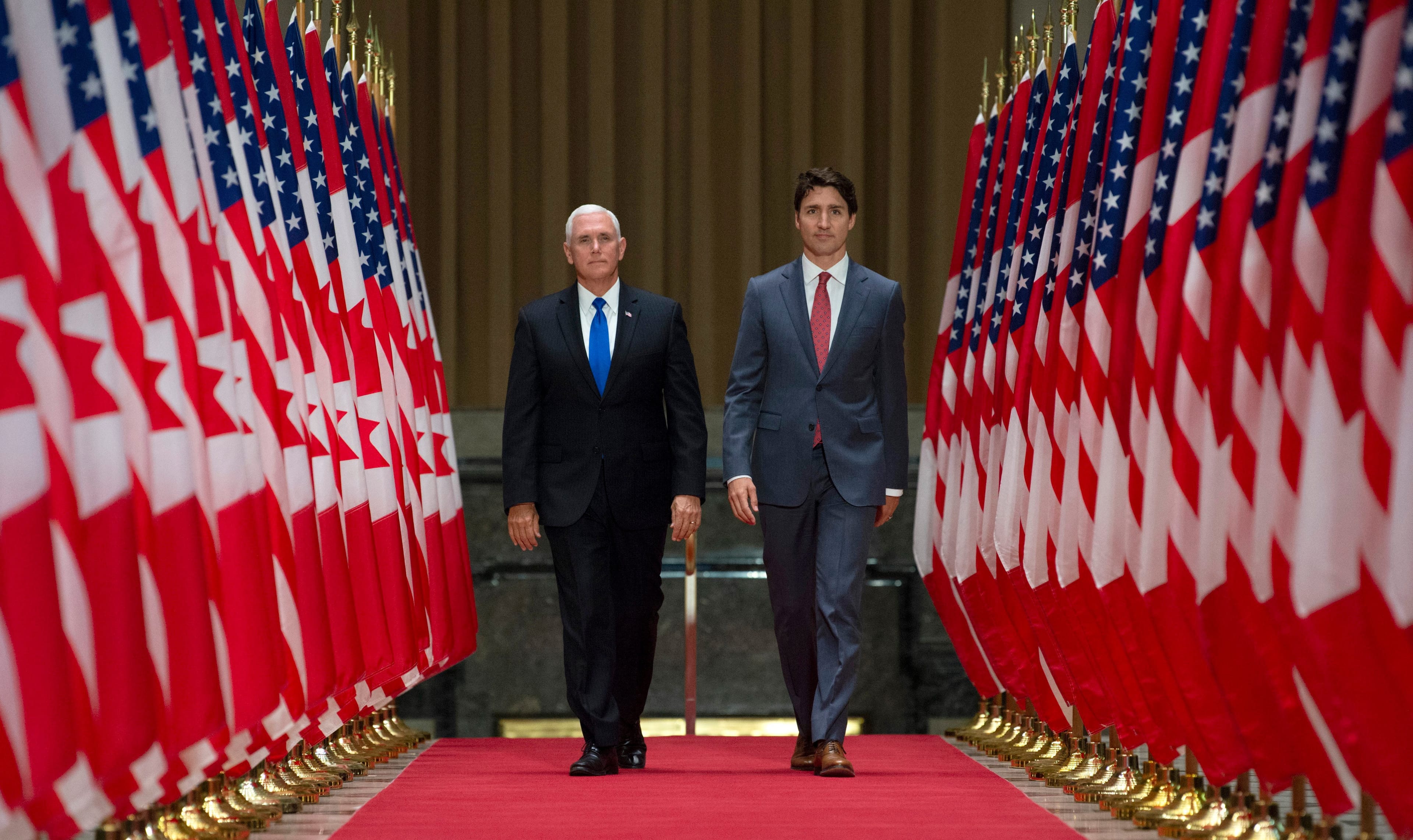 Trudeau and Pence make their way to a joint news conference in Ottawa on May 30, 2019. (Adrian Wyld/CP)