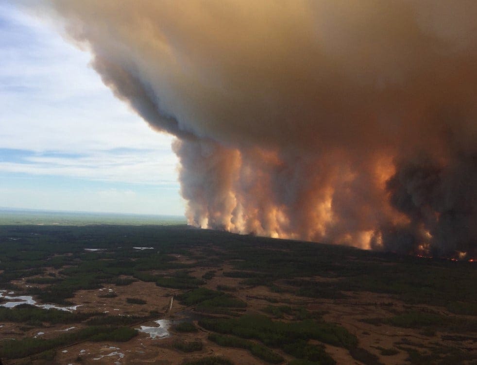 The Chuckegg Creek wildfire burns near High Level, Alta., forcing the evacuations of the town and nearby First Nations communities (@AlbertaWildfire/Twitter/CP)
