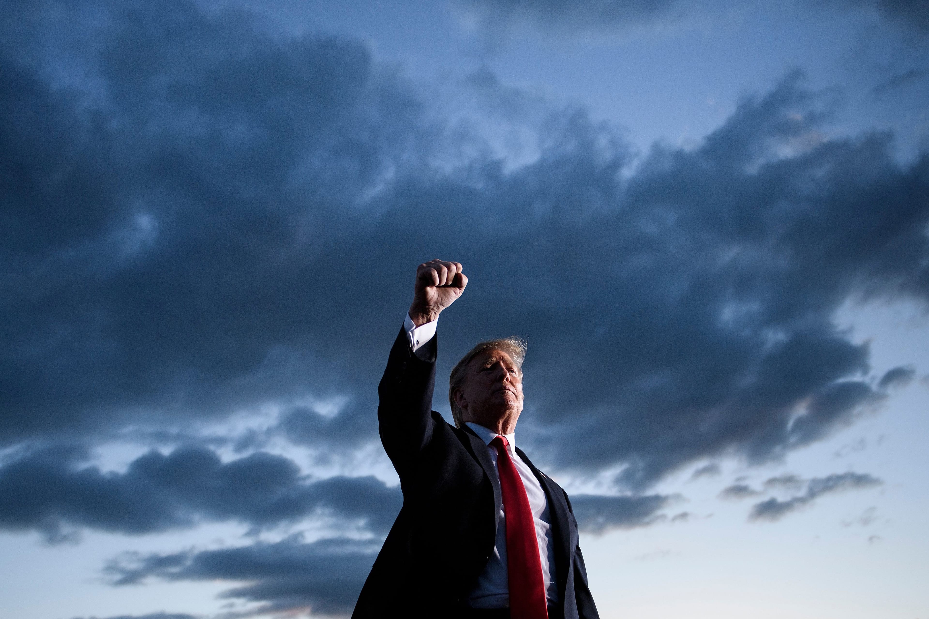 U.S. President Donald Trump holds up his fist as he leaves after speaking during a Make America Great Again rally at Williamsport Regional Airport May 20, 2019, in Montoursville, Pennsylvania. (Brendan Smialowski/AFP/Getty Images)