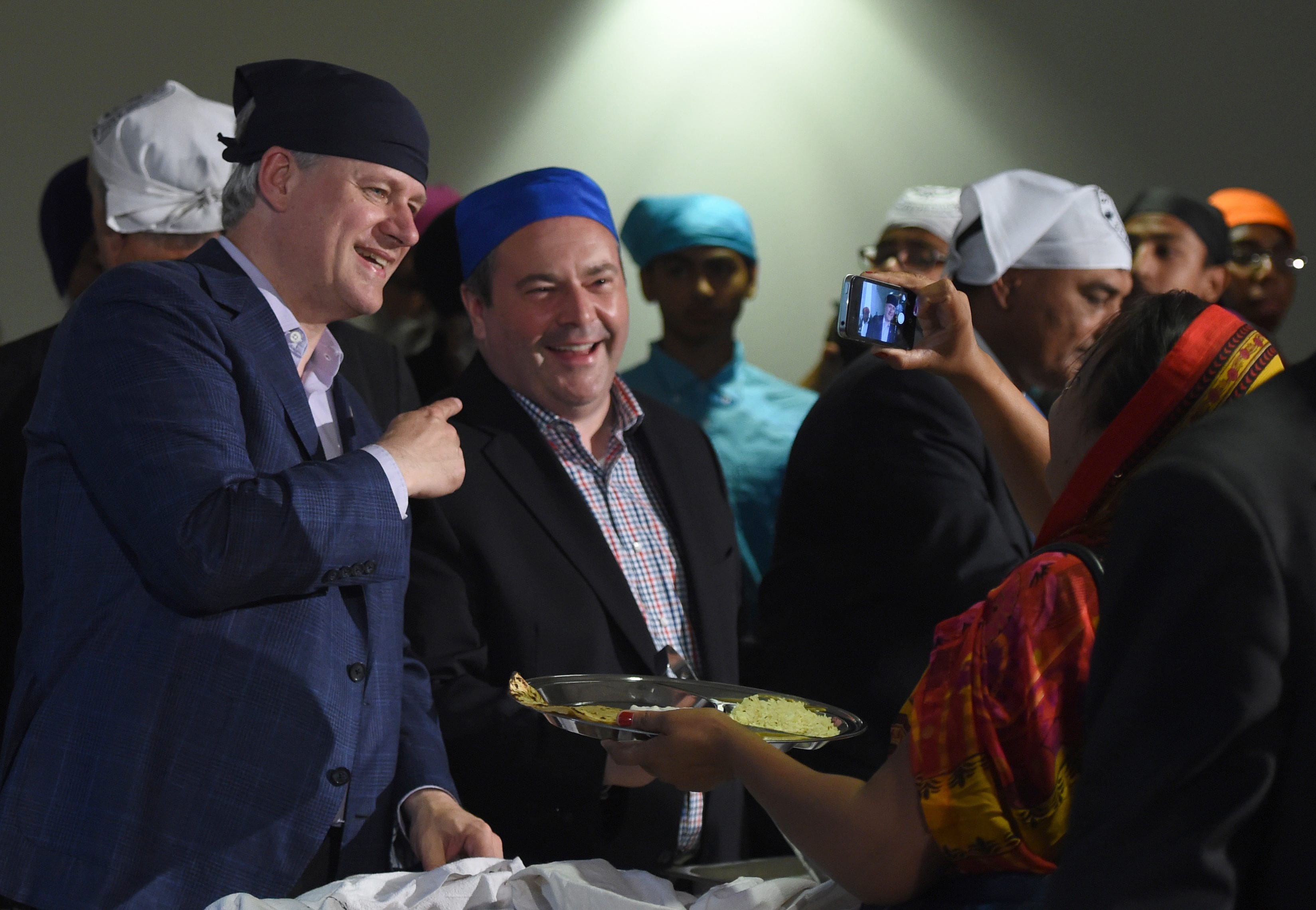 Kenney and Stephen Harper at Gursikh Sabha Canada temple during a 2015 campaign stop in Scarborough, Ont. (Sean Kilpatrick/CP)