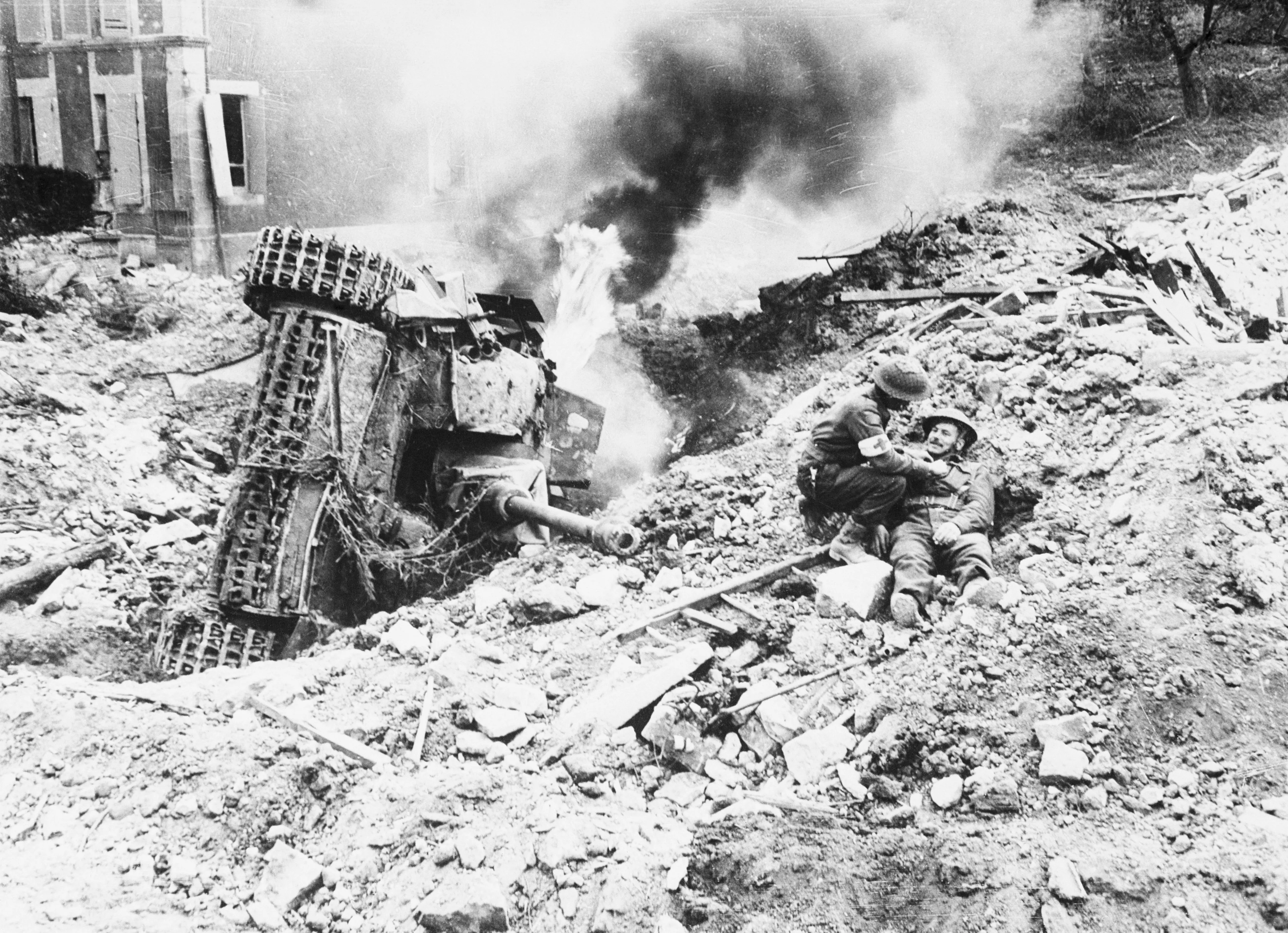 A Canadian Army medical corpsman tends to a Canadian soldier during the battle for Falaise on July 16, 1944 (Bettmann/Getty Images)