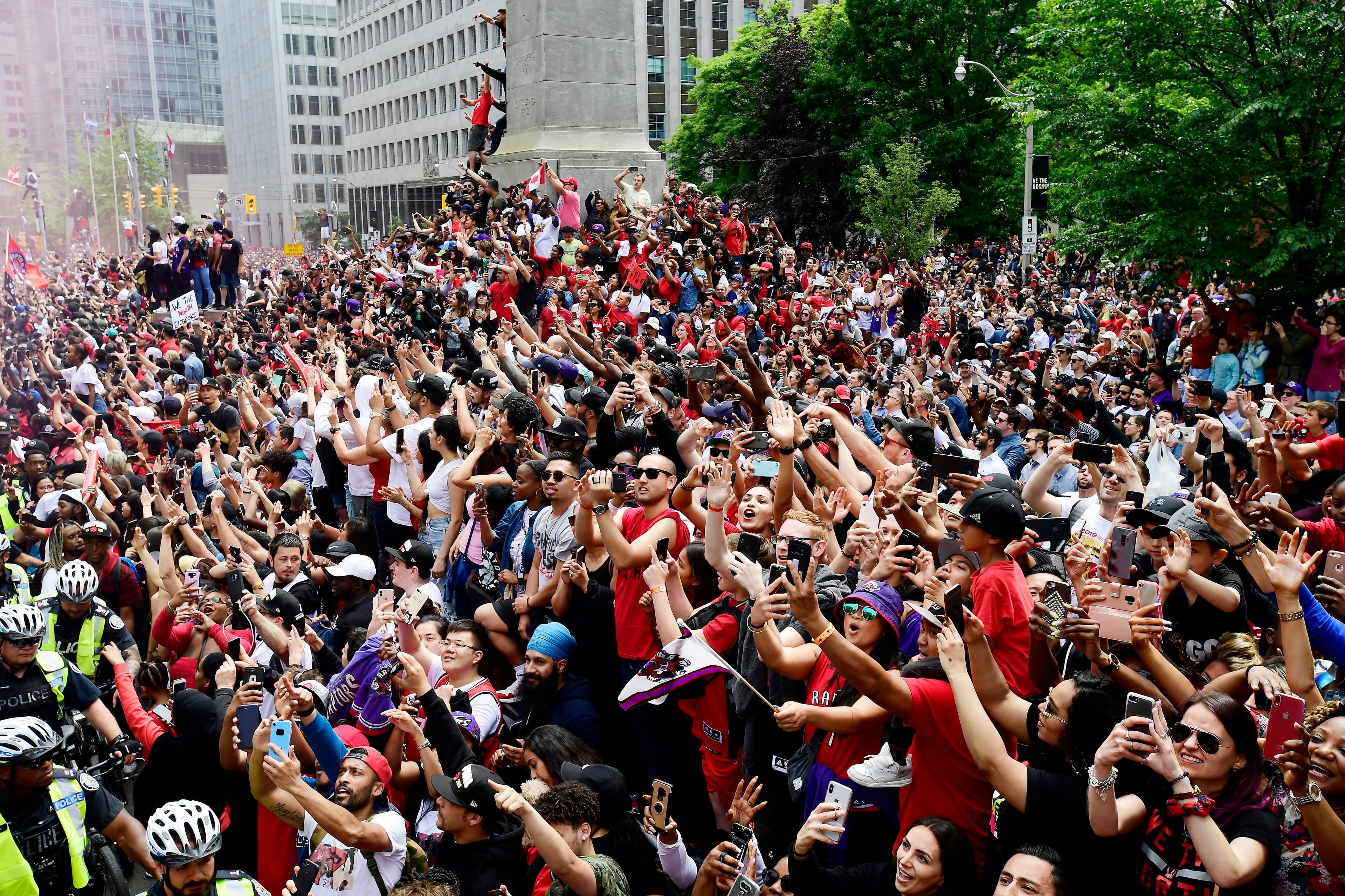Fans celebrate during the 2019 Toronto Raptors Championship parade in Toronto on Monday, June 17, 2019. THE CANADIAN PRESS/Frank Gunn