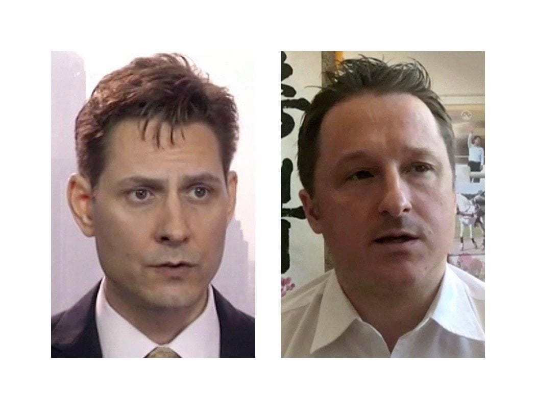 Kovrig (left) and Spavor have been jailed in China for over six months (AP/CP)