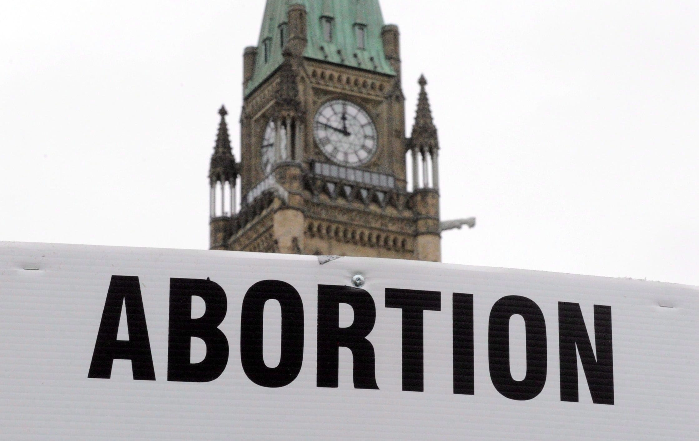 Pro-life supporters hold anti-abortion signs as they take part in the March For Life rally on Parliament Hill in Ottawa on Thursday, May 10, 2012. There is a growing debate over abortion and reproductive rights on university campuses in Canada as they increasingly become the focal point of both crisis pregnancy centres and anti-abortion student groups. (Sean Kilpatrick/CP)