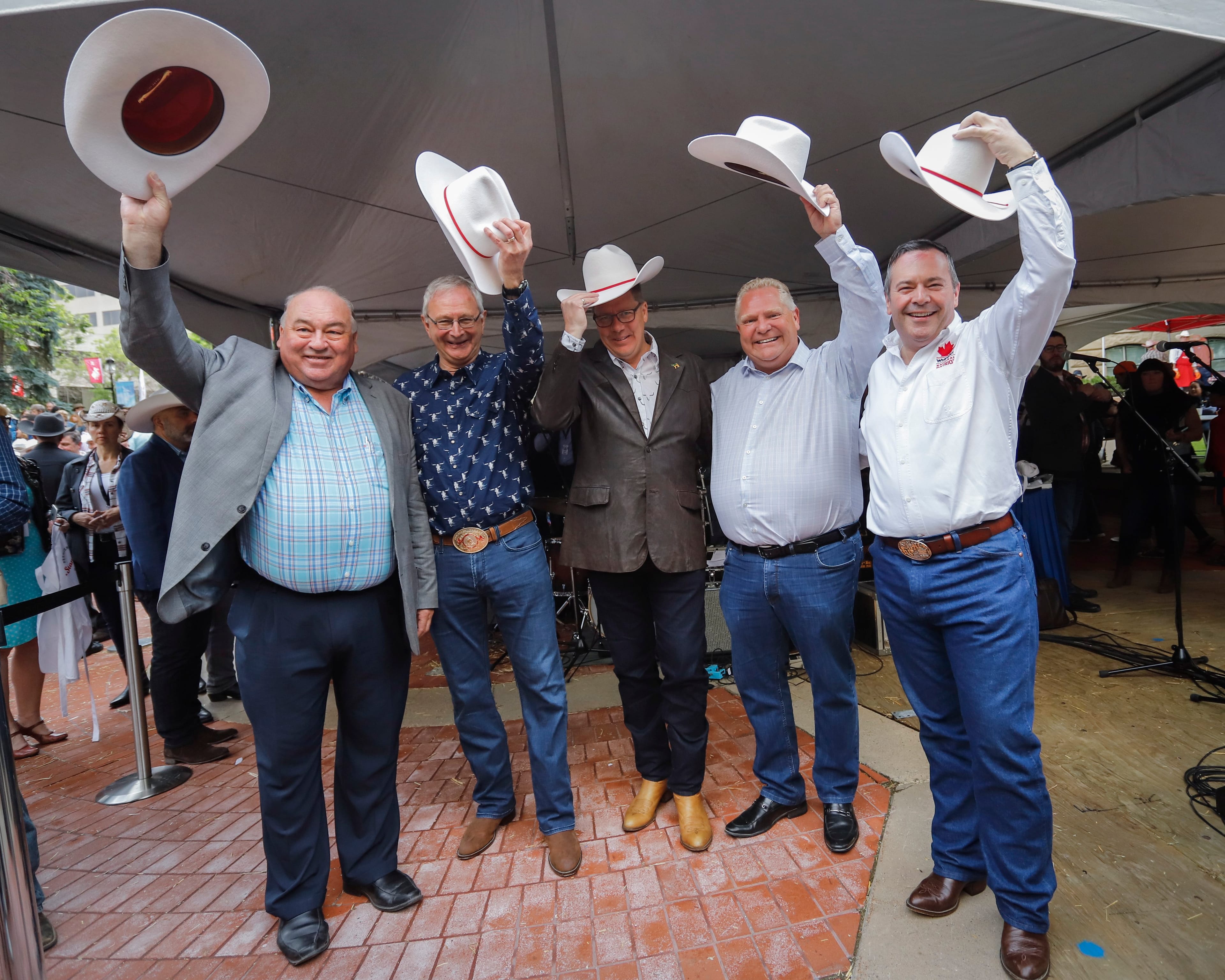 Alberta Premier Jason Kenney, far right, hosts a Stampede breakfast with visiting premiers, left to right, Robert McLeod, of the Northwest Territories, Blaine Higgs, of New Brunswick, Scott Moe, of Saskatchewan, and Doug Ford, of Ontario, in Calgary, Monday, July 8, 2019. (Jeff McIntosh/CP)