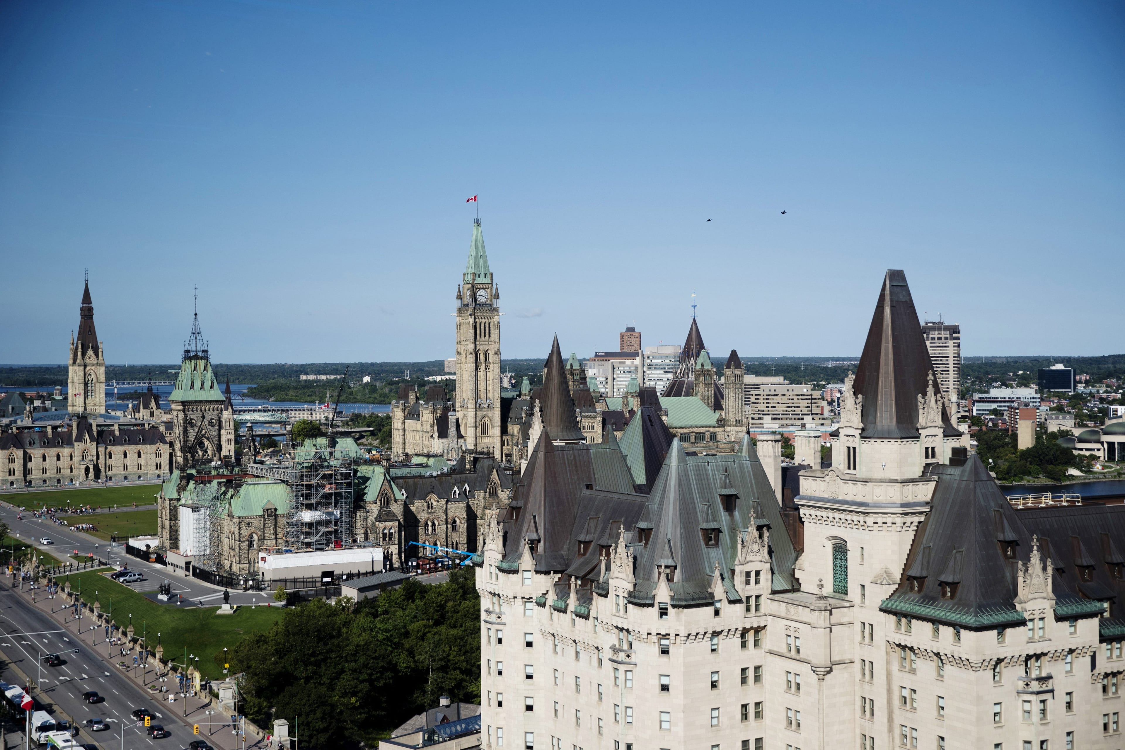 Parliament Hill, left, stands behind the Chateau Laurier hotel in Ottawa on Aug. 16, 2018. (Brent Lewin/Bloomberg via Getty Images)