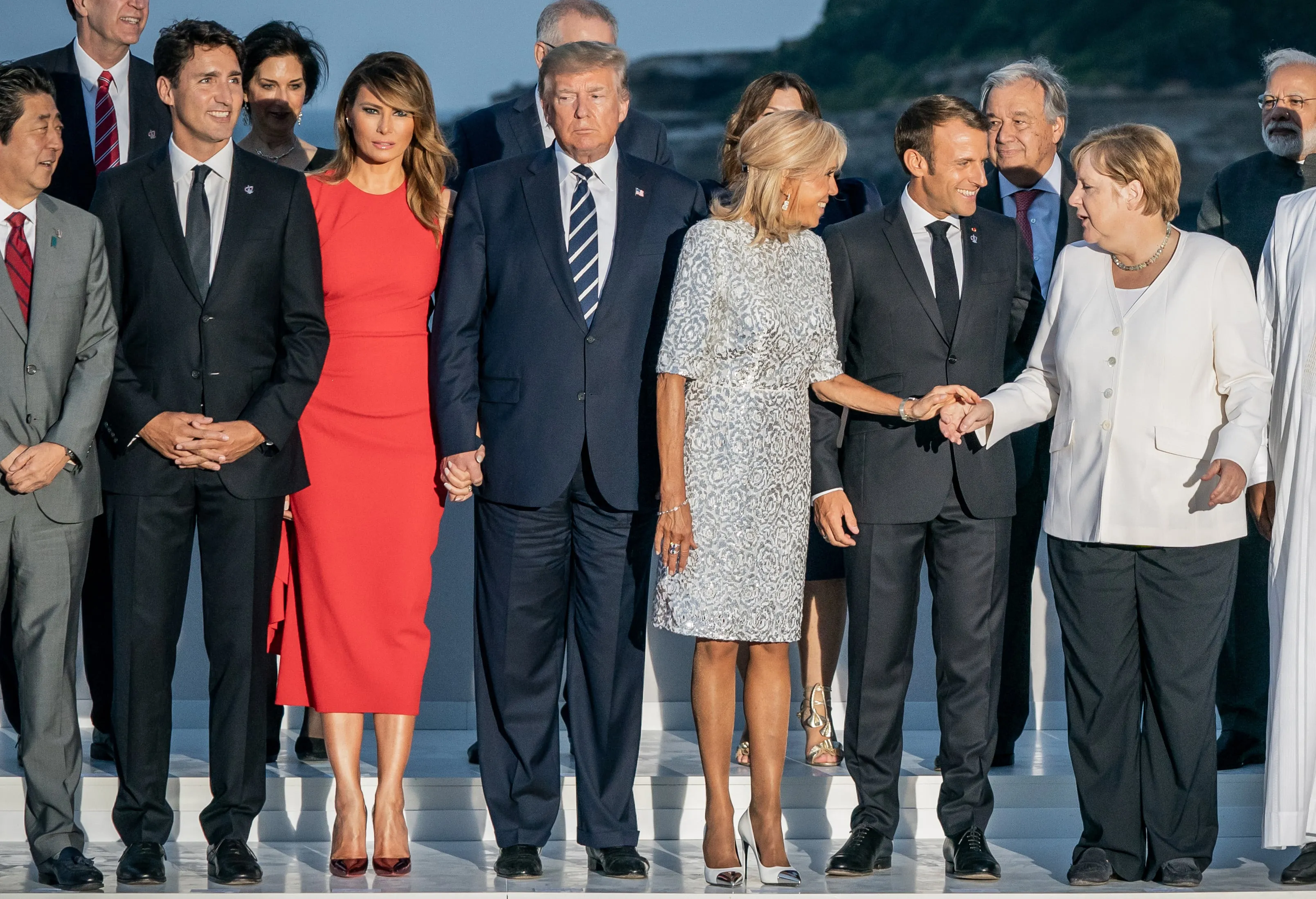 The heads of state and government of the G7, the guest countries and the heads of the international organizations stand together at the group photo on August 25, 2019, in Biarritz, France. (front row (l-r). Shinzo Abe, Prime Minister of Japan, Justin Trudeau, Prime Minister of Canada, Melania Trump and Donald Trump, President of the USA, Brigitte Macron and Emanuel Macron, President of France, Chancellor Angela Merkel (CDU). (Michael Kappeler/picture alliance/Getty Images)