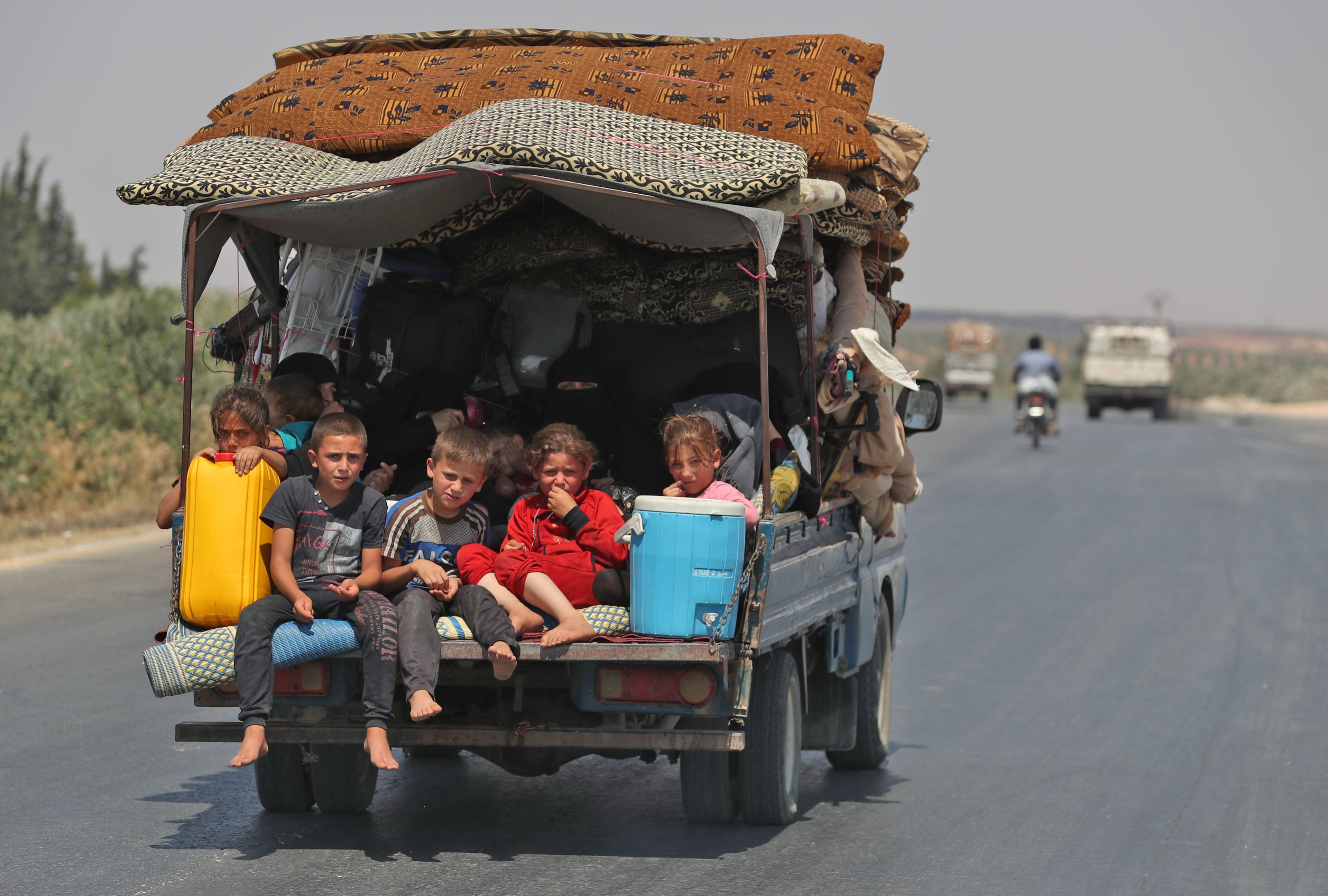 Syrian civilians flee Idlib on Aug. 22, 2019. Government bombardments have killed hundreds there since late April (OMAR HAJ KADOUR/AFP/Getty Images)