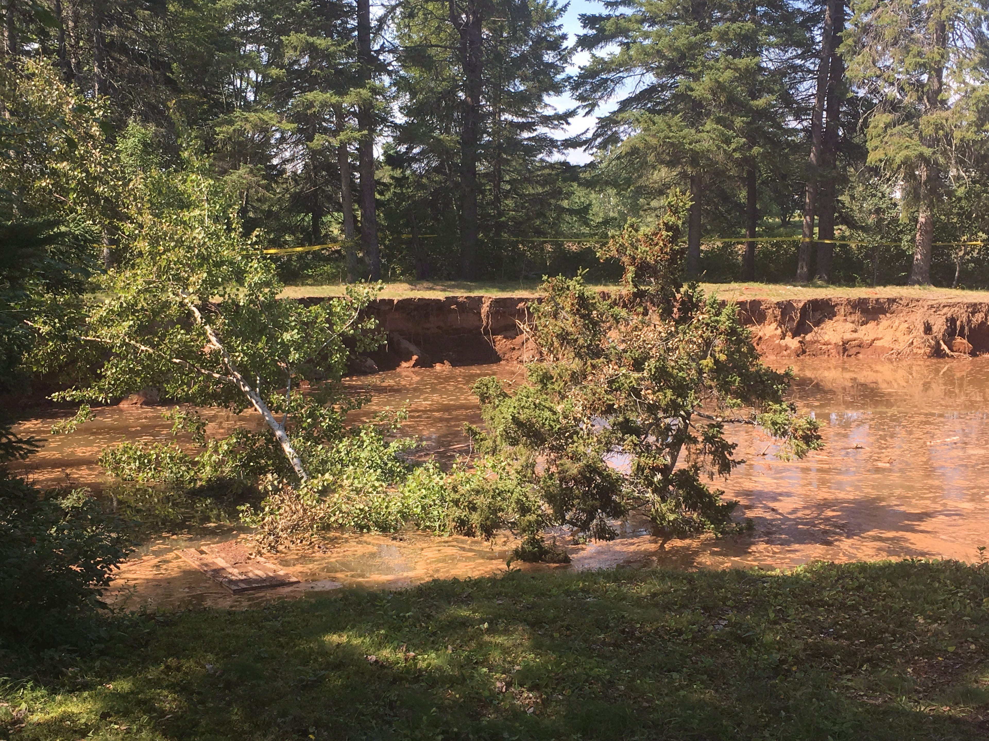The Oxford sinkhole, as seen one year ago. It has since rendered the local Lions Club unusable. (CP/Rob Roberts)