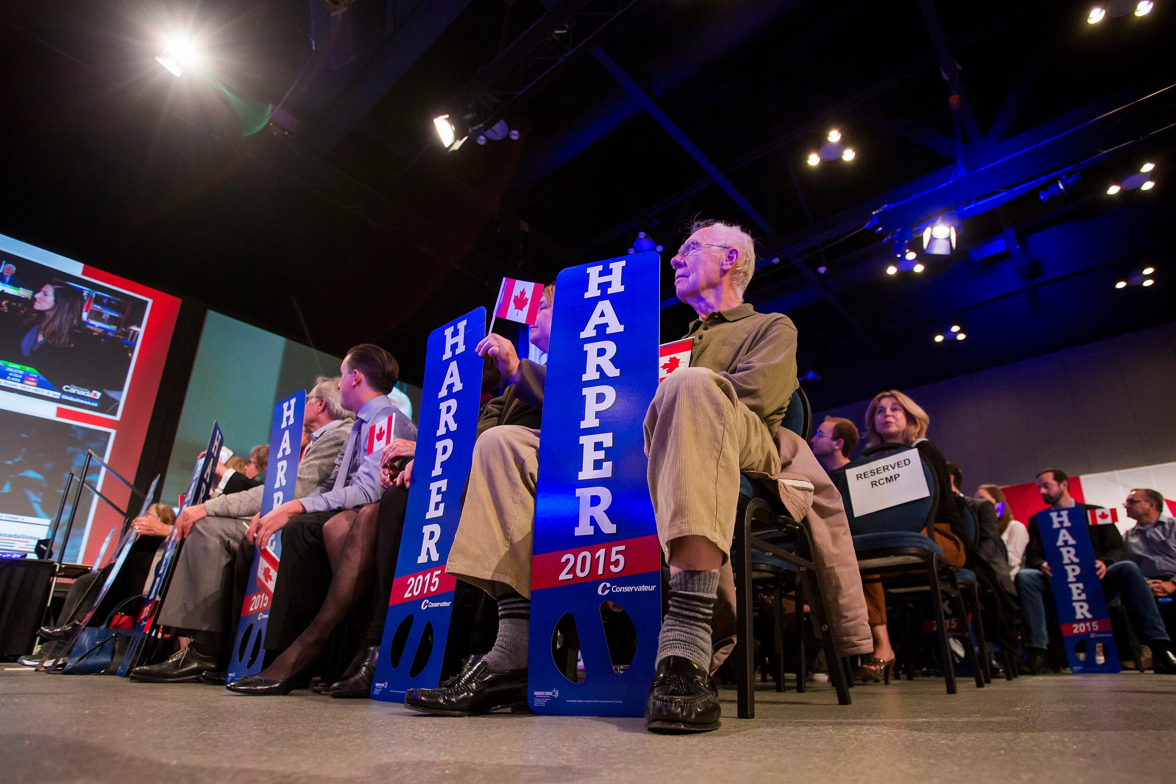 Supporters of Conservative Leader Stephen Harper watch the polls as news agencies project a Liberal government on election day in Calgary, Alberta, Canada, on Monday, Oct. 19, 2015. (Ben Nelms/Bloomerg)