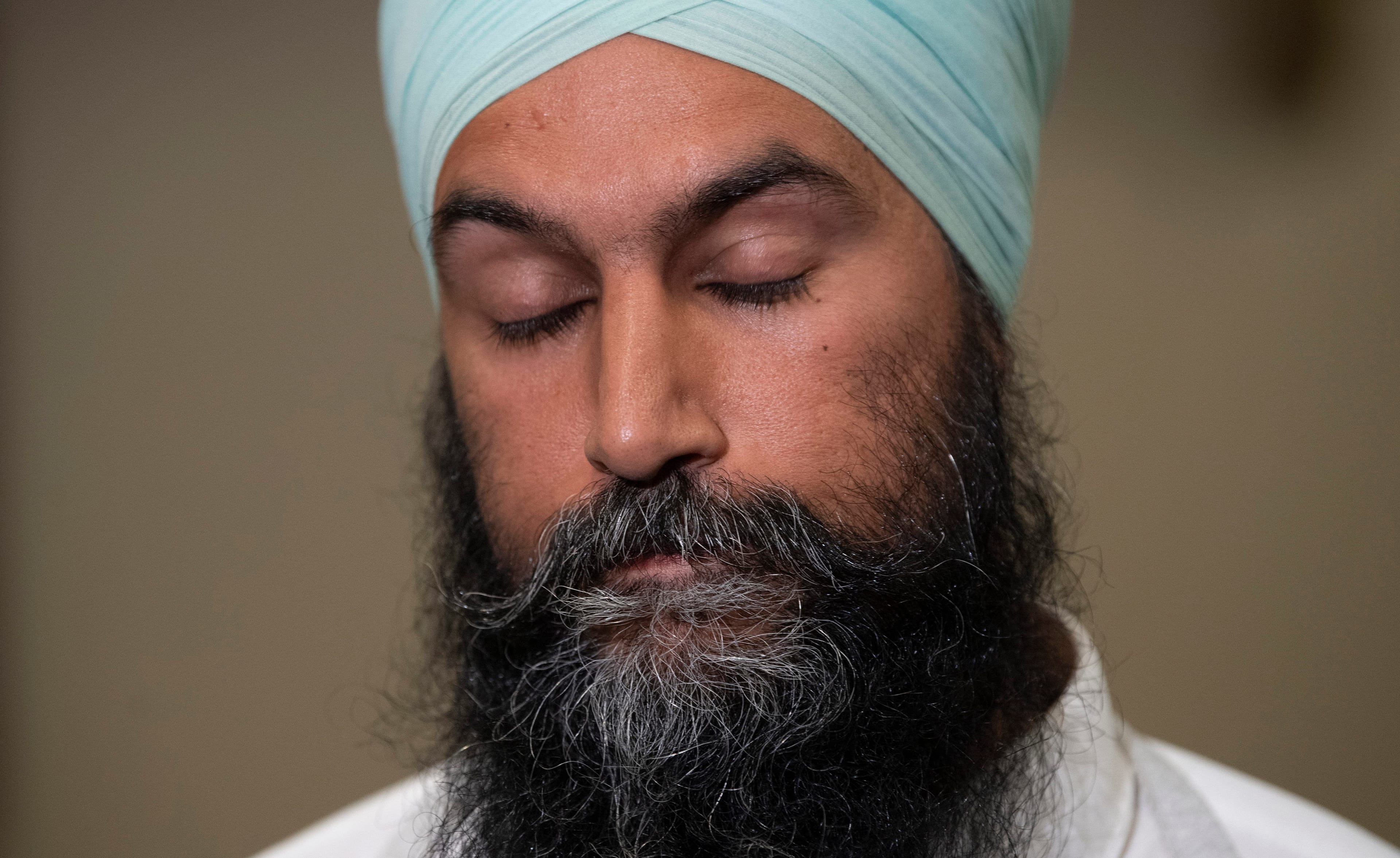 Singh pauses as he comments on photos of Justin Trudeau in brownface (Adrian Wyld/CP)