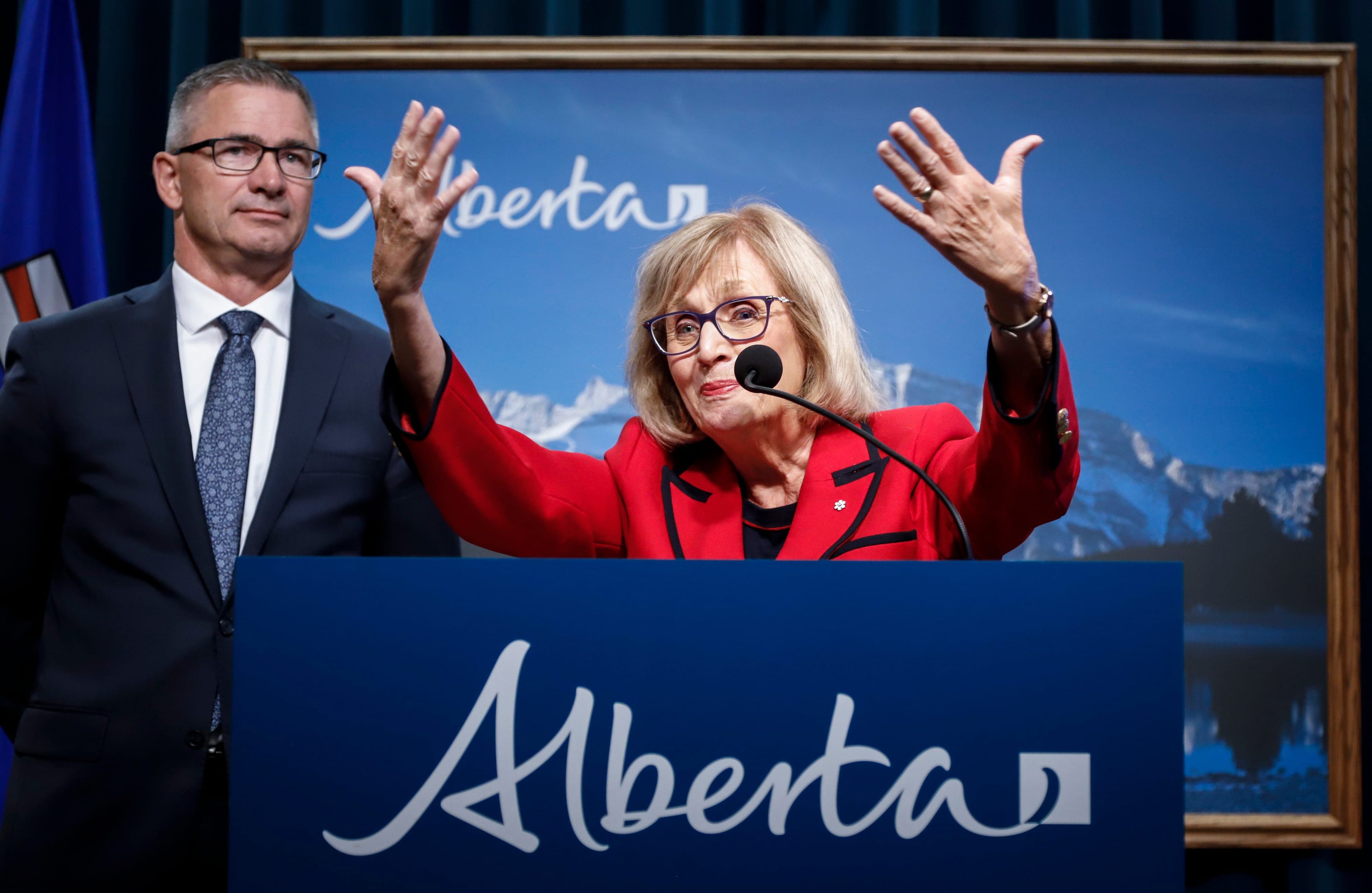 Janice MacKinnon, chair of the blue ribbon panel on Alberta’s finances, with provincial Finance Minister Travis Toews (Jeff McIntosh/CP)