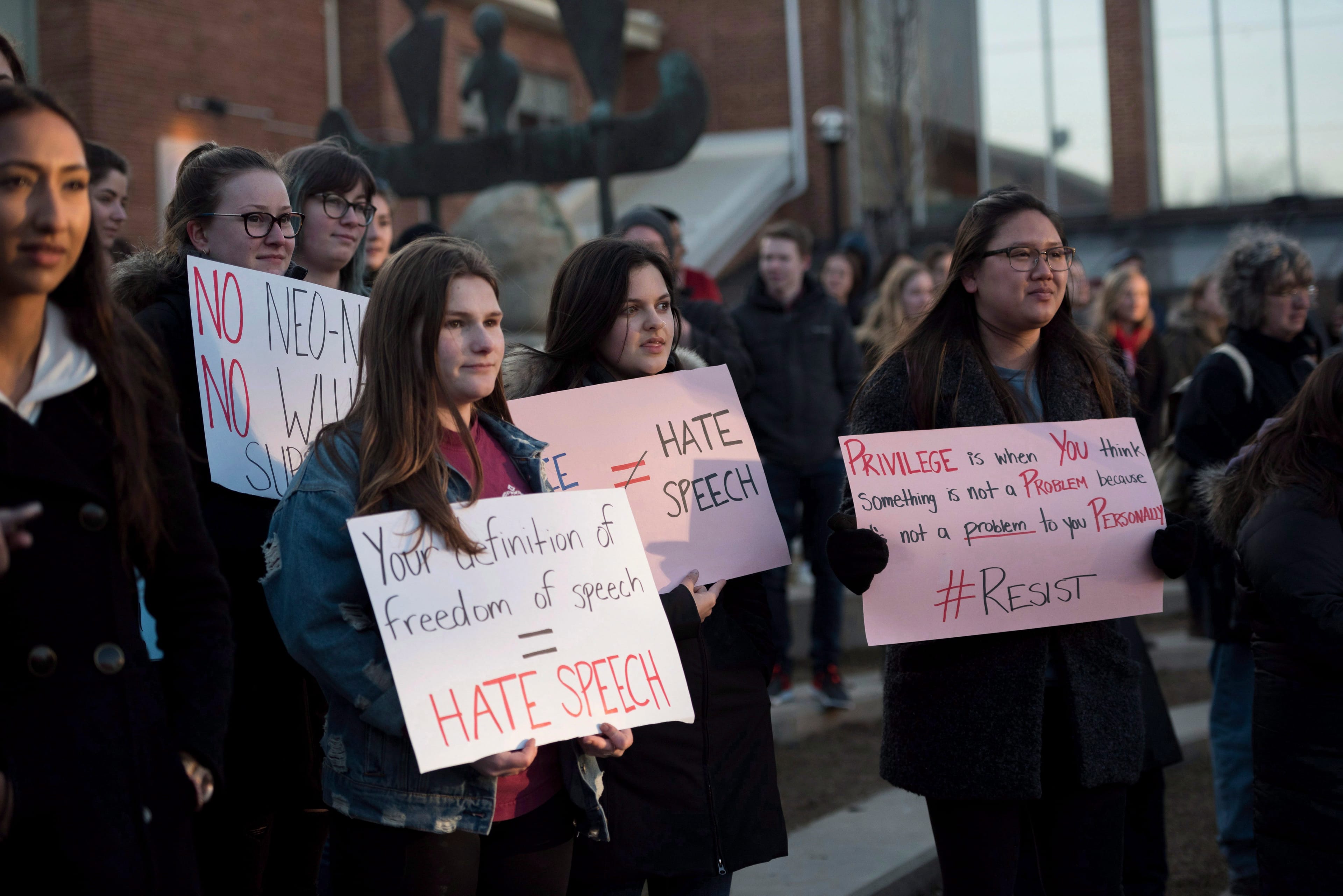 Students protest Faith Goldy’s appearance at Wilfrid Laurier University in Waterloo, Ont., in 2018 (Hannah Yoon/CP)