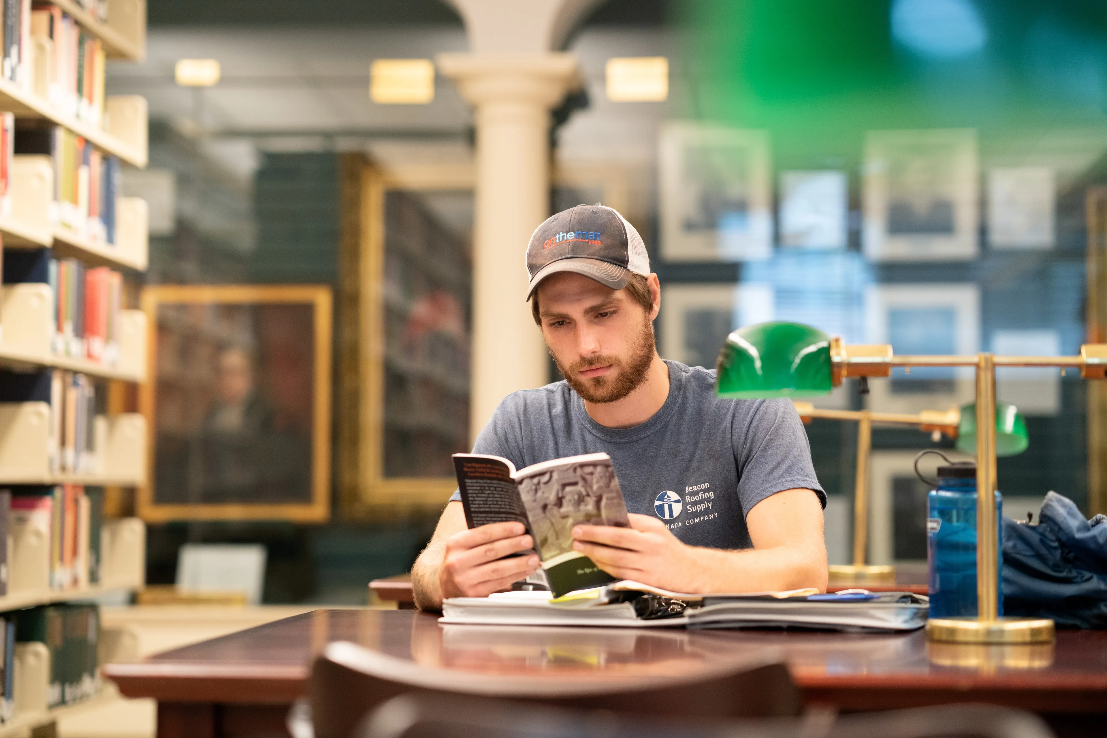 Reading 'Gilgamesh' in Halifax: a student studies amongst the 80,000 books in King’s Library (Photograph by Ian Selig)