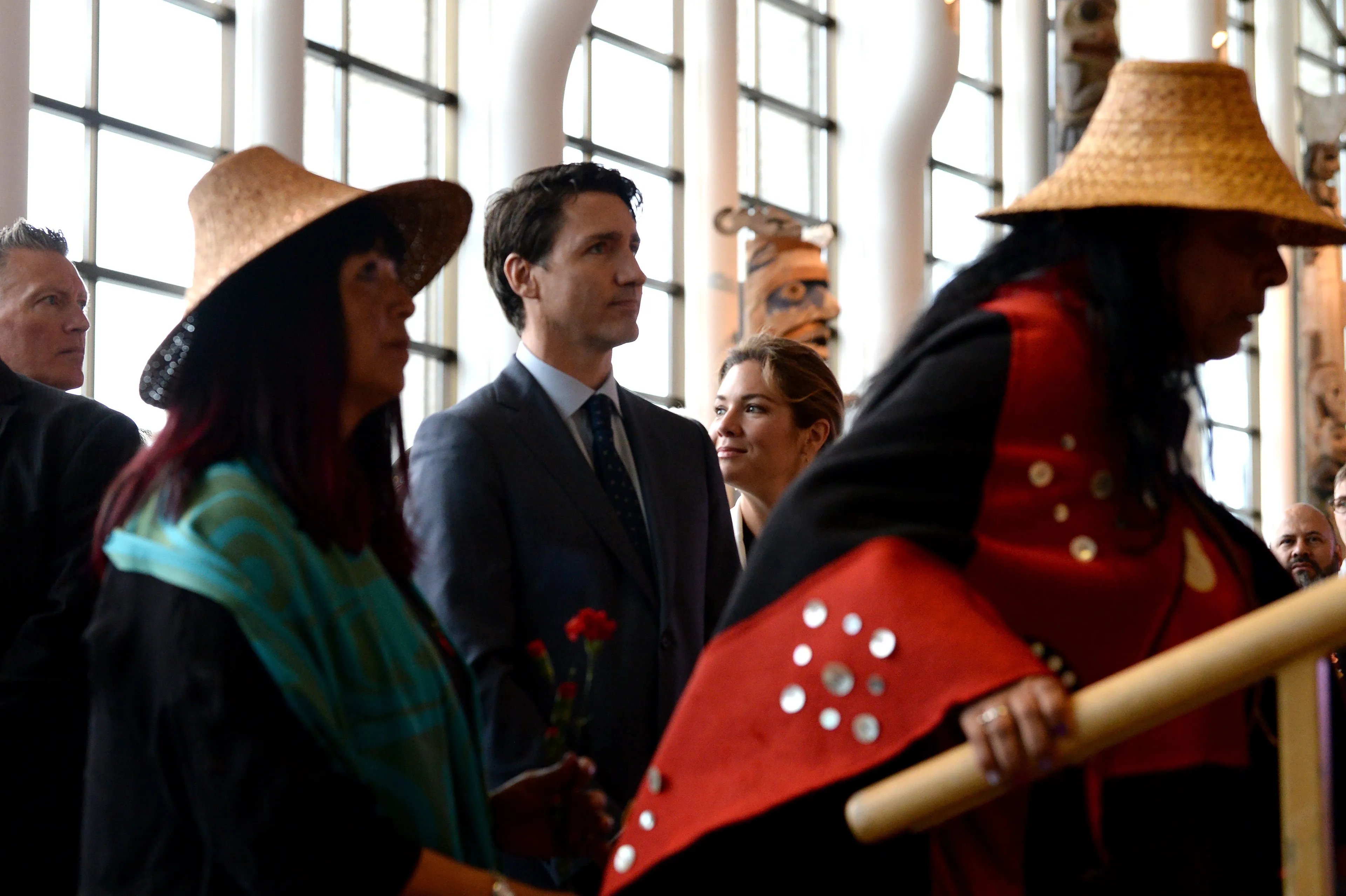 Prime Minister Justin Trudeau looks on as the procession takes the stage at the closing ceremony for the National Inquiry into Missing and Murdered Indigenous Women and Girls in Gatineau, Que., on Jun 3, 2019. (CP/Adrian Wyld)