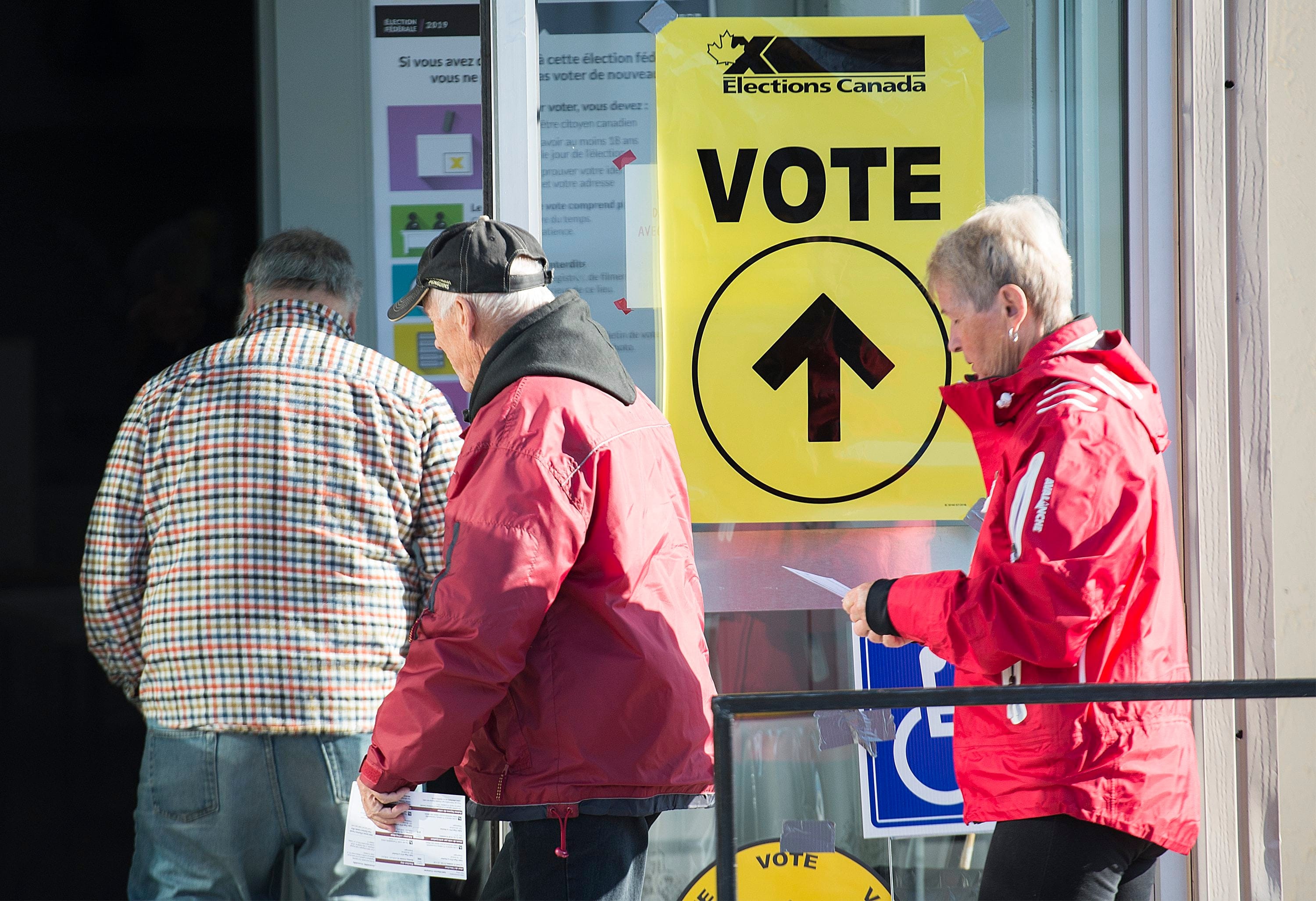 People arrive at a polling station in Shawinigan, Que., to cast their ballots for the 2019 federal election (Graham Hughes/CP)