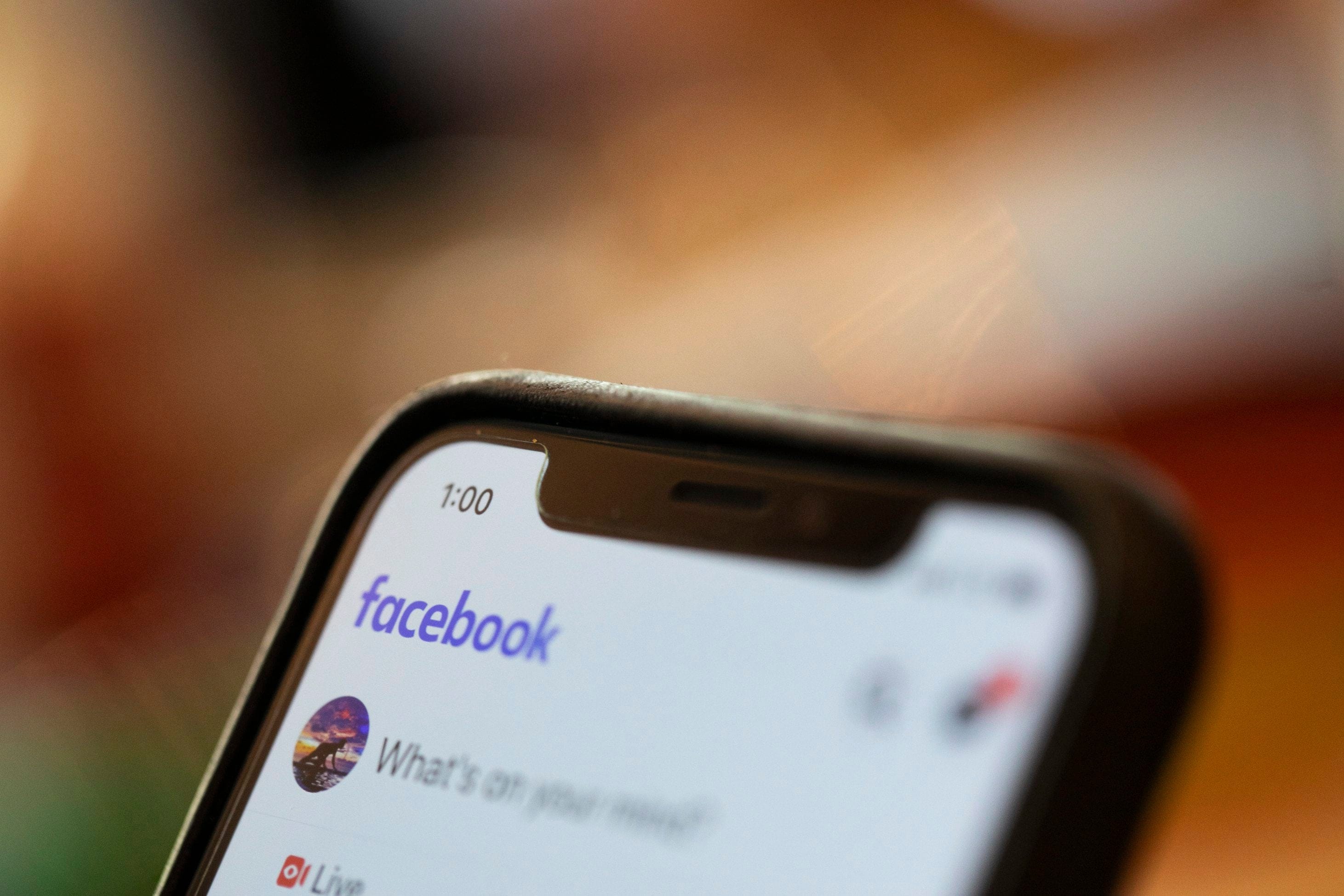 On Aug. 11, 2019, photo an iPhone displays a Facebook page in New Orleans. Facebook says it paid contractors to transcribe audio clips from users of its Messenger service. (AP/Jenny Kane)