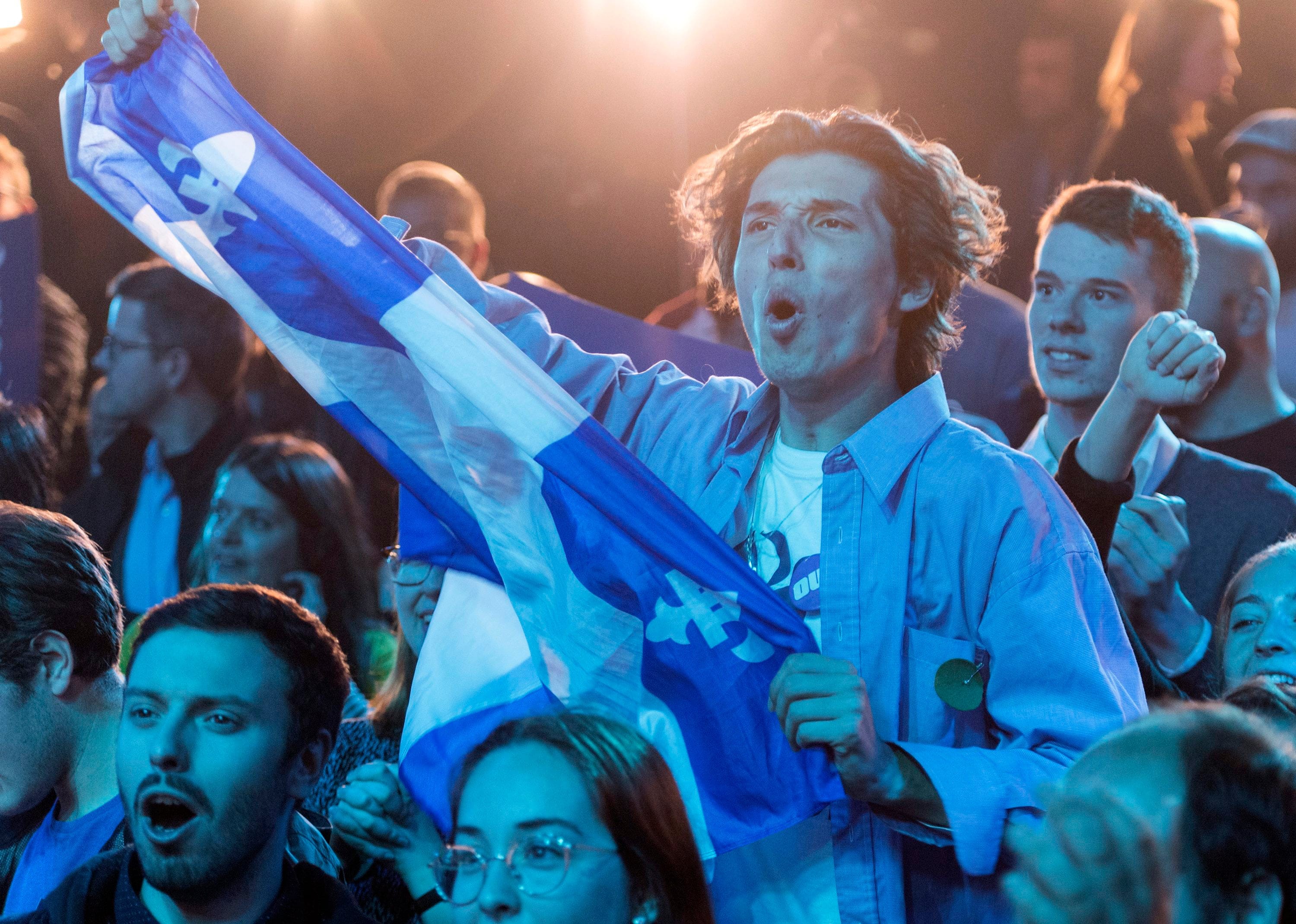 Bloc Quebecois supporters react as results come in on federal election night in Montreal (Graham Hughes/CP)