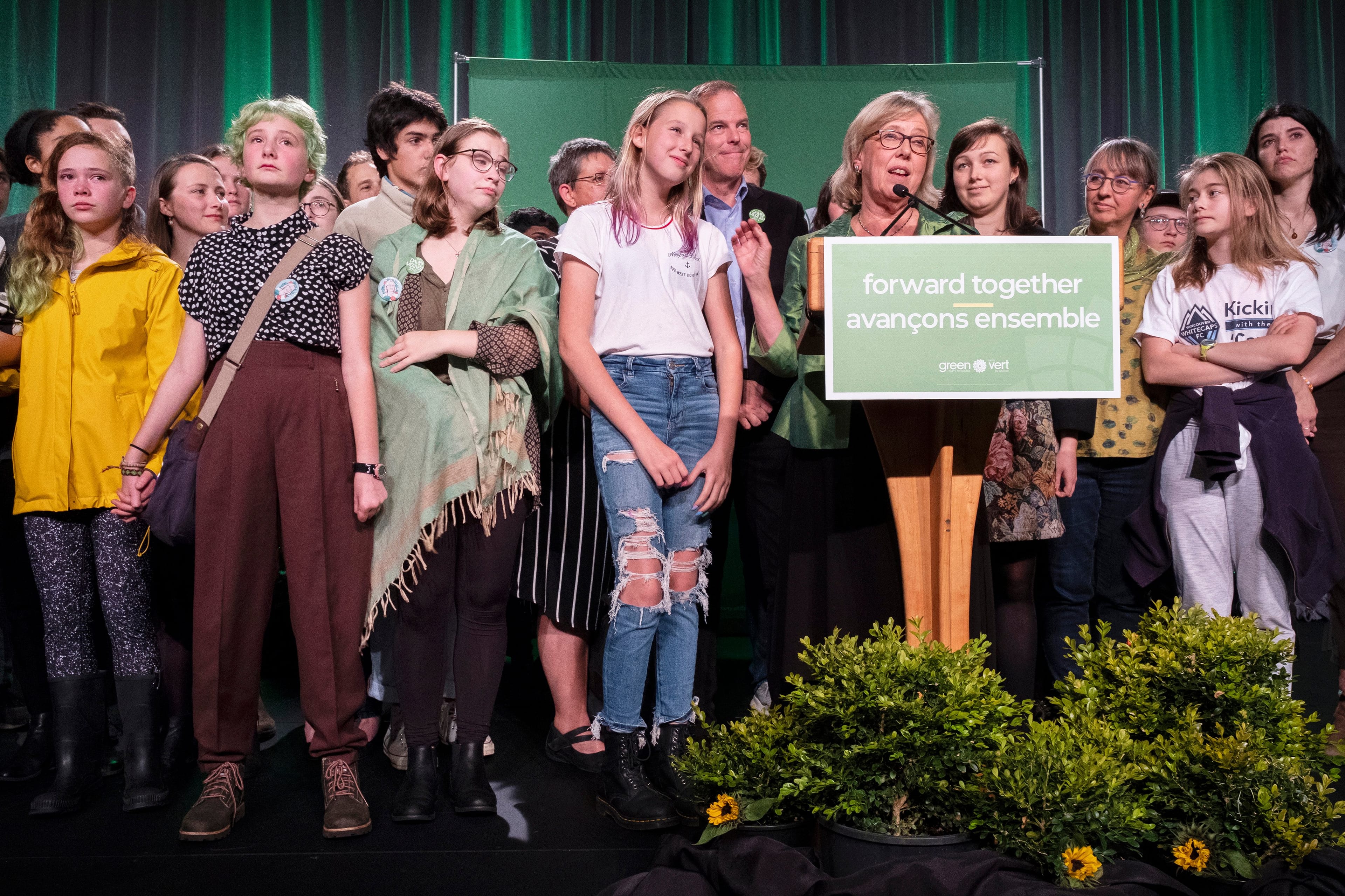May delivers a speech on election night alongside supporters. (Photograph by Jen Osborne)