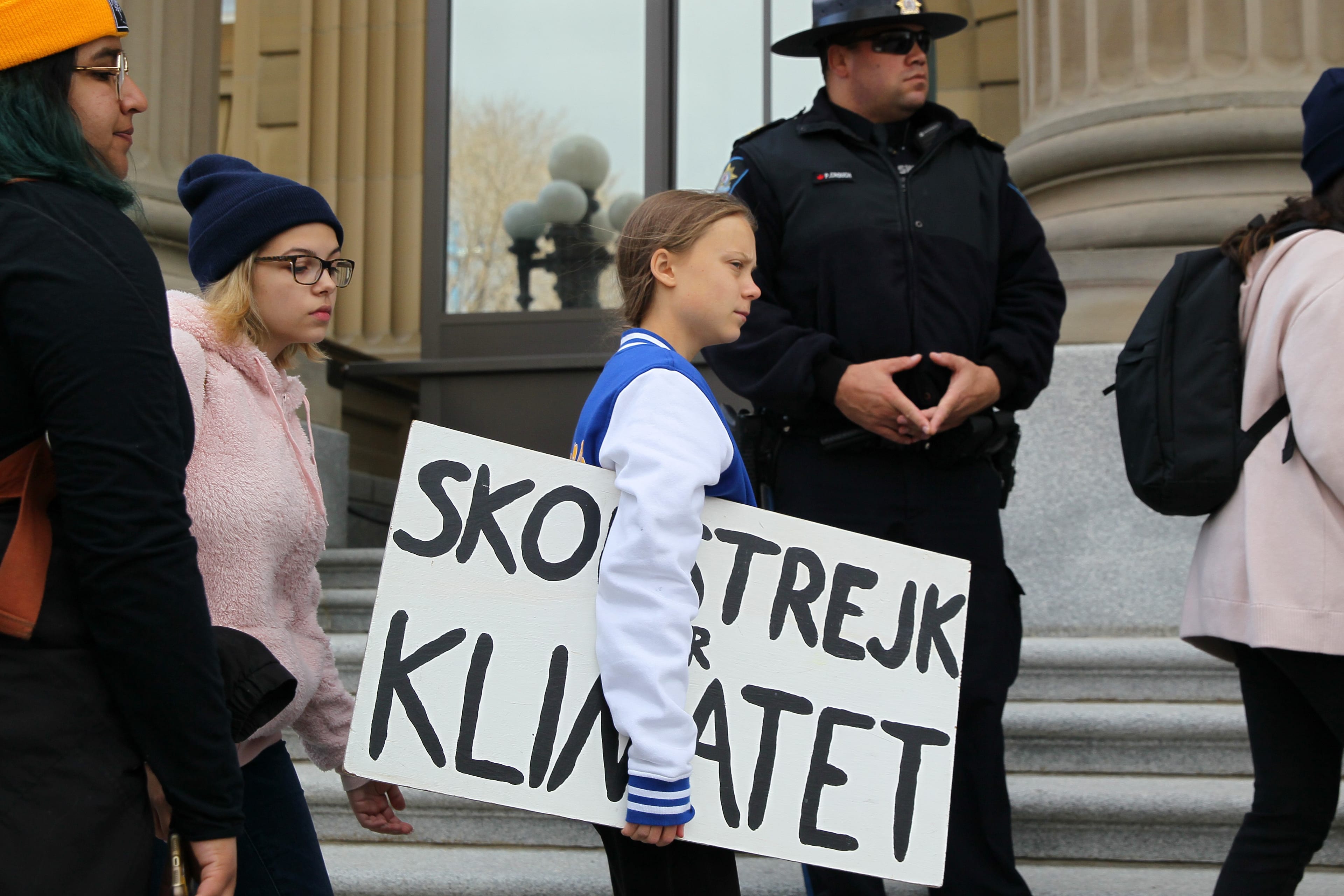 Thunberg (centre) and climate change activists gather for a rally Friday at the Alberta legislature (Dave Chidley/CP)