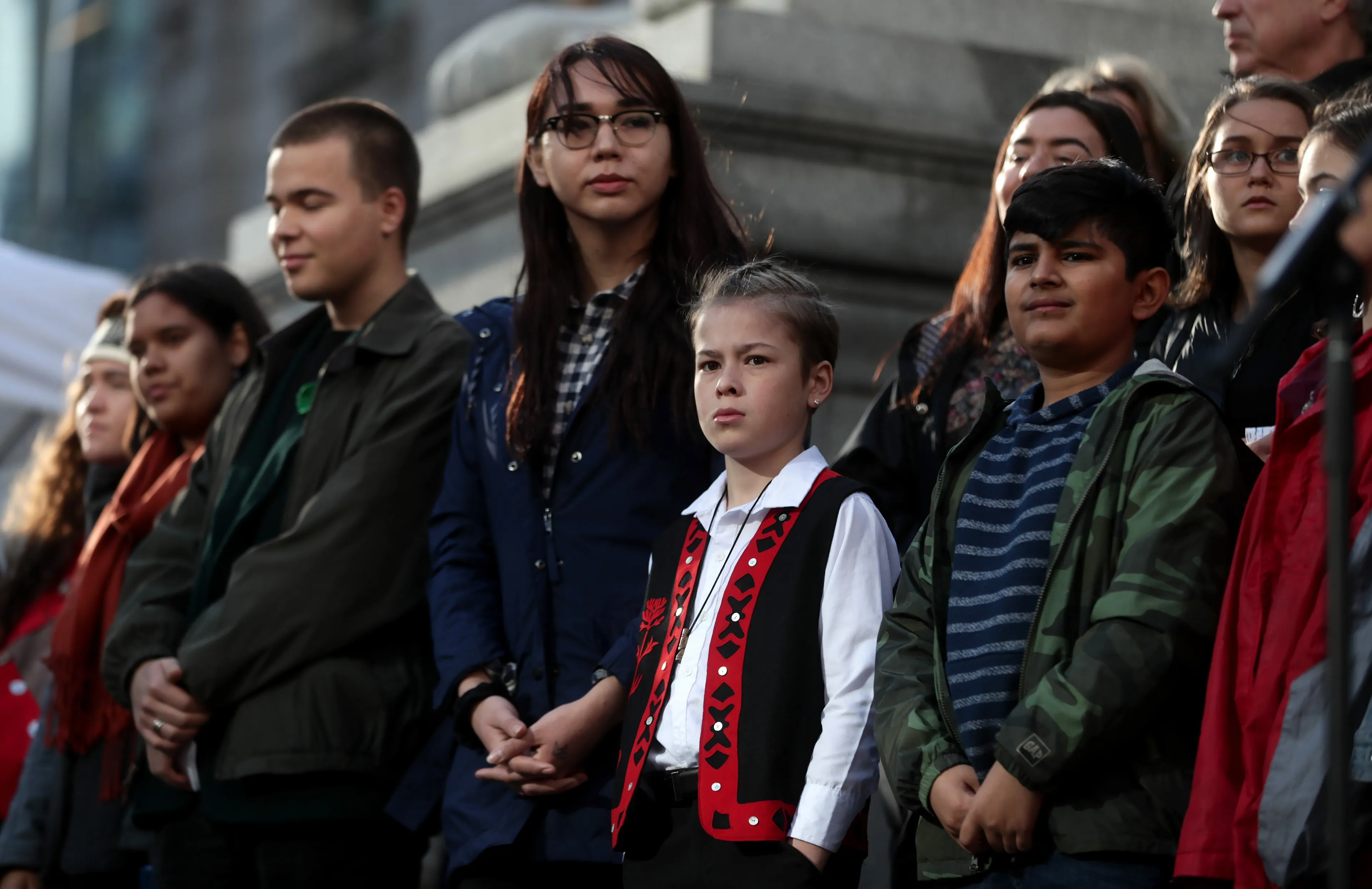 Some of the 15 young people who are parties to a lawsuit filed against the federal government for contributing to high levels of greenhouse gas emissions and dangerous climate change are seen at a press conference, in Vancouver, Friday, Oct. 25, 2019. THE CANADIAN PRESS/Darryl Dyck