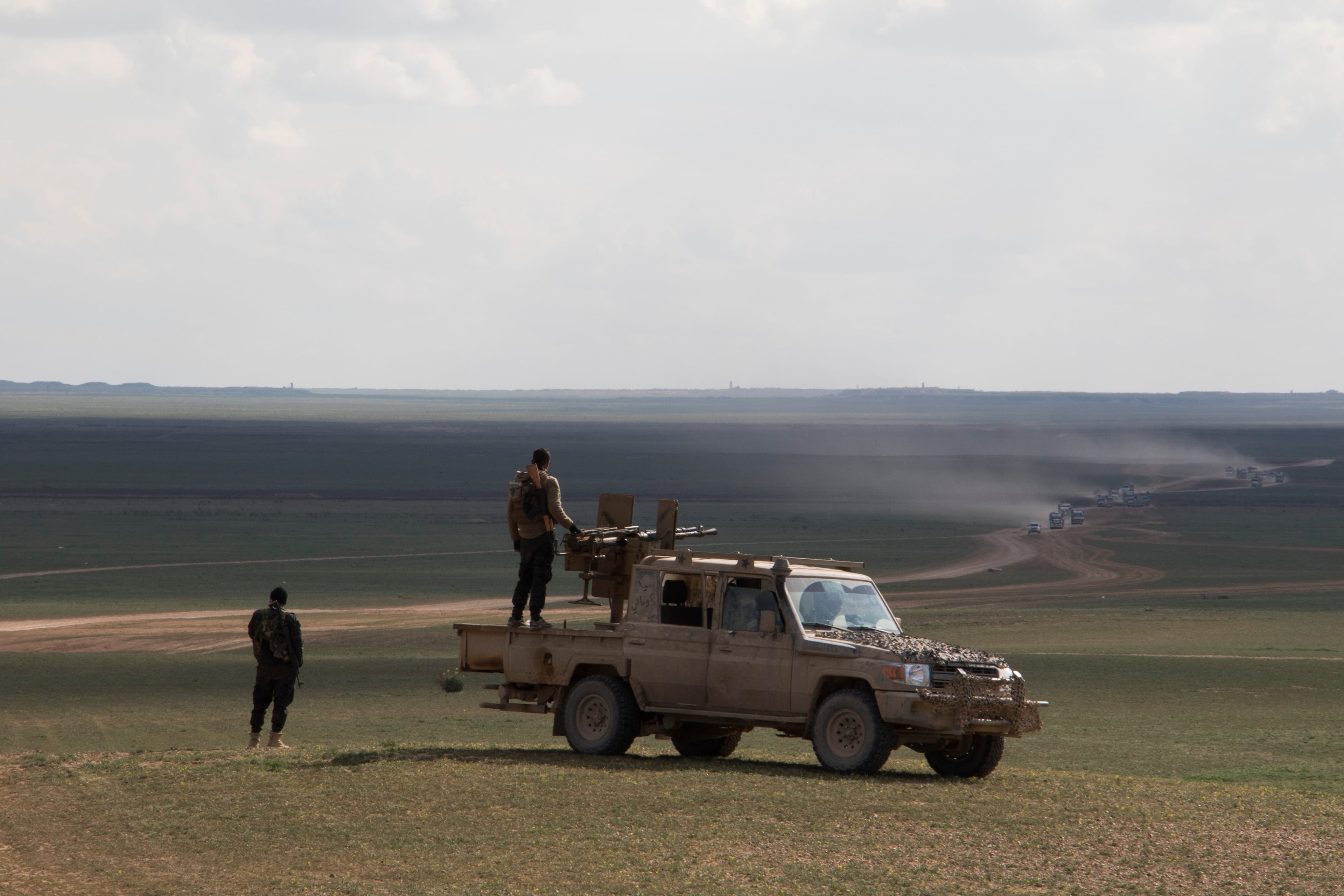 Truckloads of refugees pour out of Baghouz, a Syrian village in the Euphrates Valley near the Iraqi border where ISIS made its last stand (Photograph by Adnan R. Khan)
