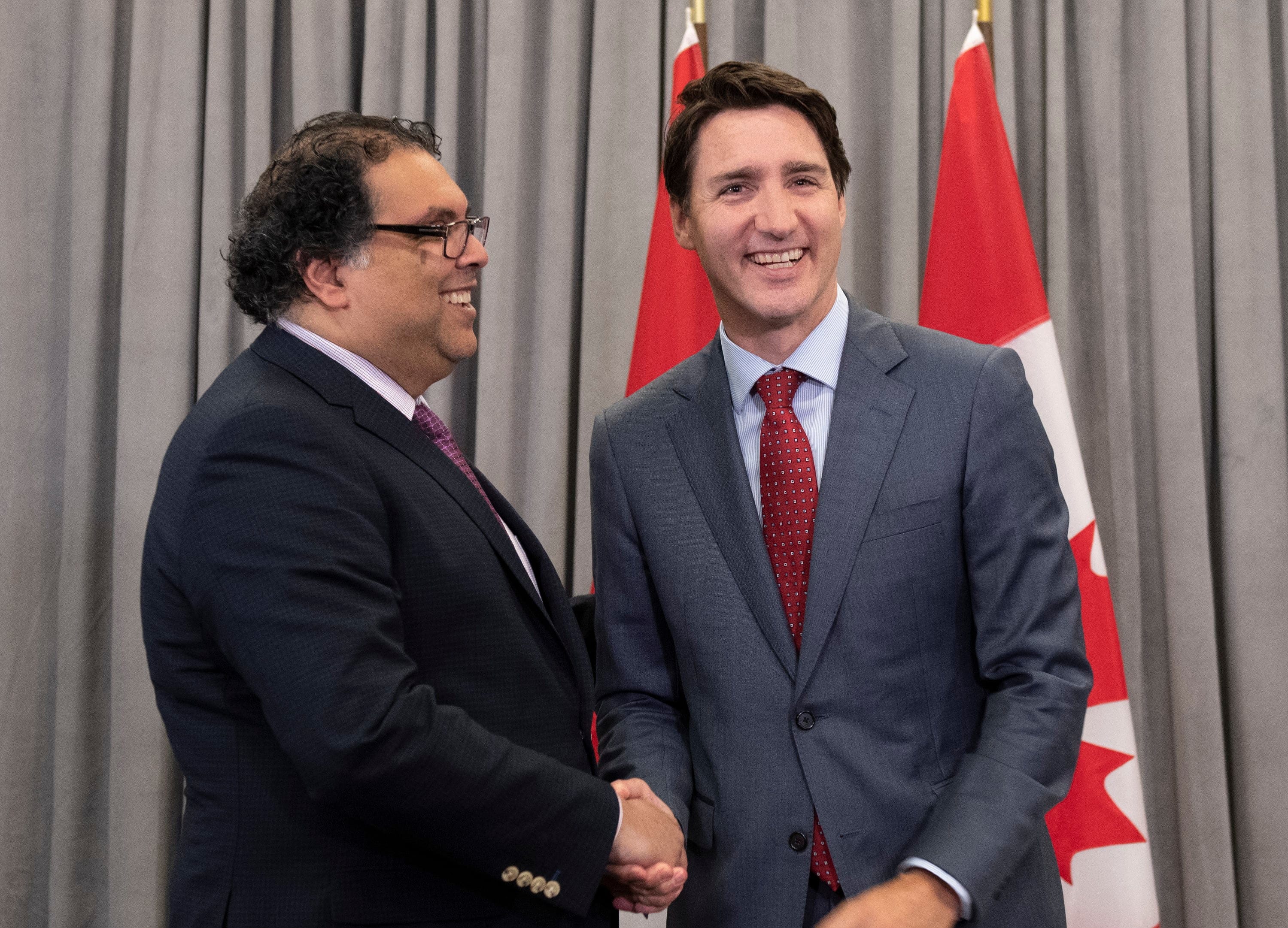 Prime Minister Justin Trudeau, right, meets with the Mayor of Calgary, Naheed Nenshi, at the Federation of Canadian Municipalities annual conference, Friday, May 31, 2019 in Quebec City. (Jacques Boissinot/CP)