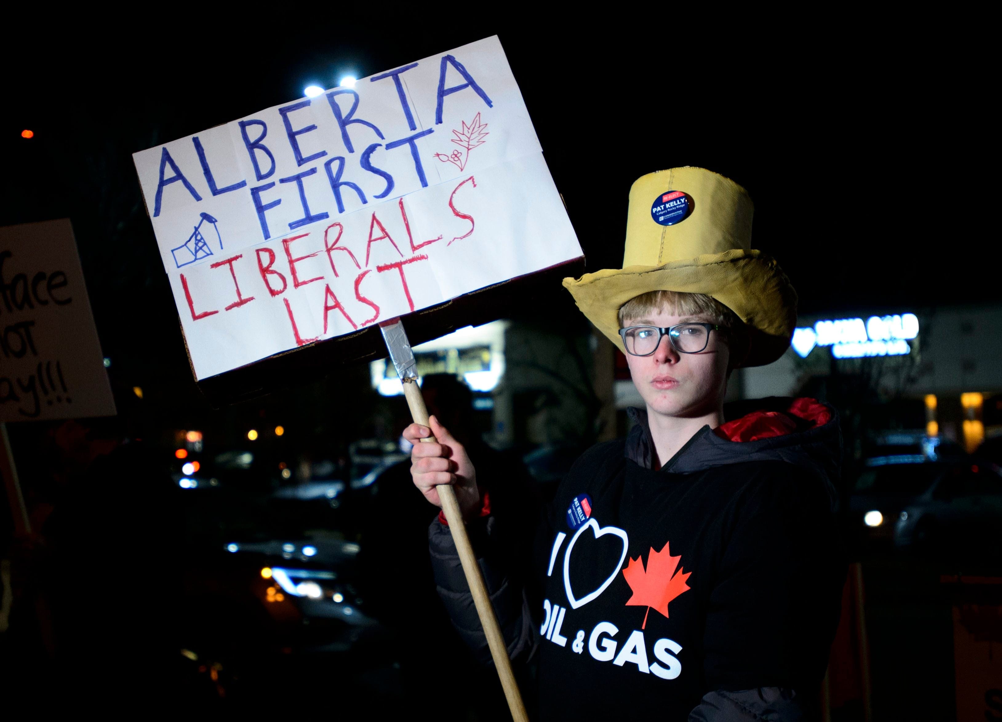 A protester outside Liberal Leader Justin Trudeau's rally on Saturday in Calgary (Sean Kilpatrick/CP)