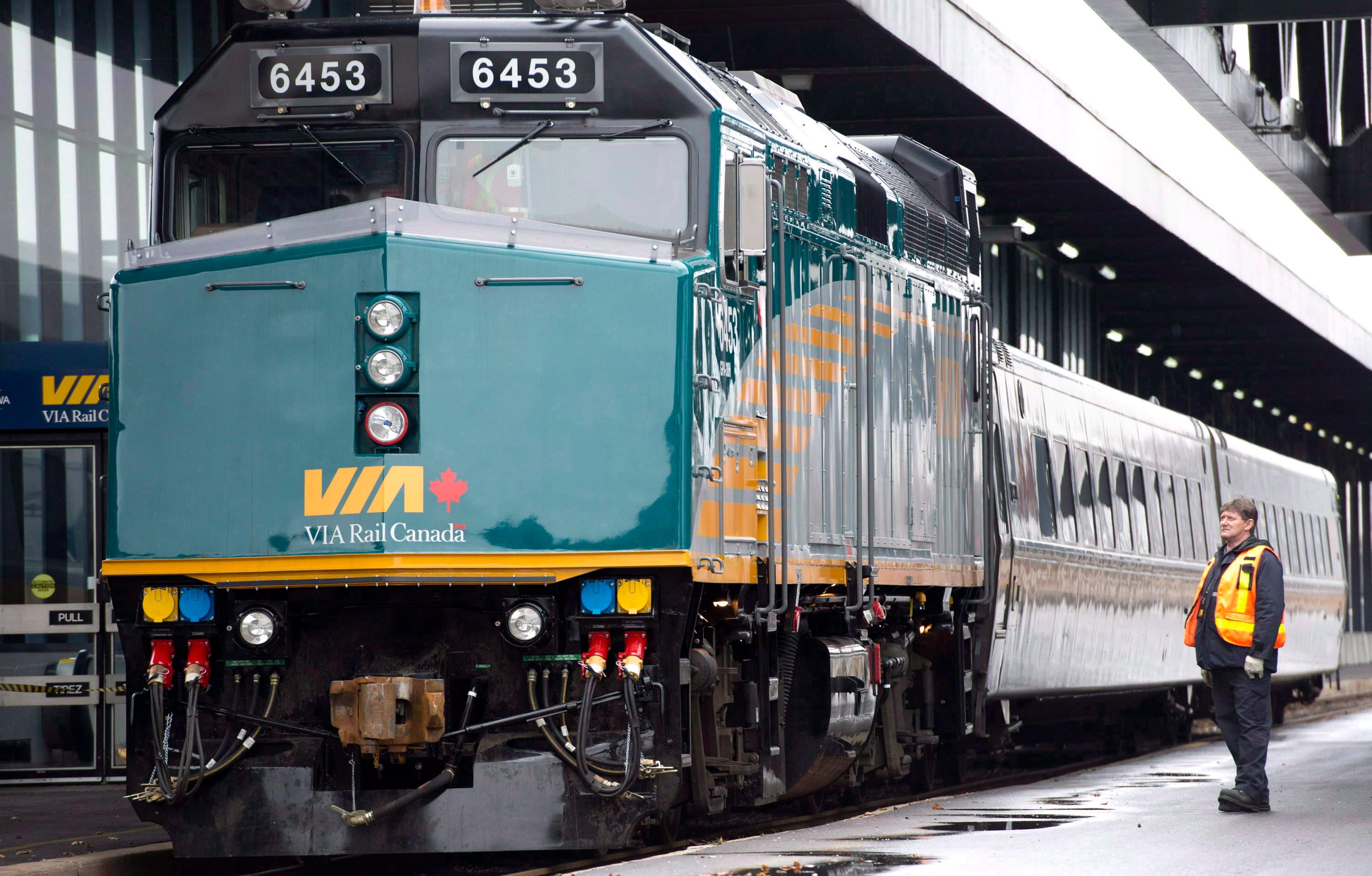 A VIA Rail employee stands on the platform at the train station in Ottawa on Dec. 3, 2012 (THE CANADIAN PRESS/Adrian Wyld)