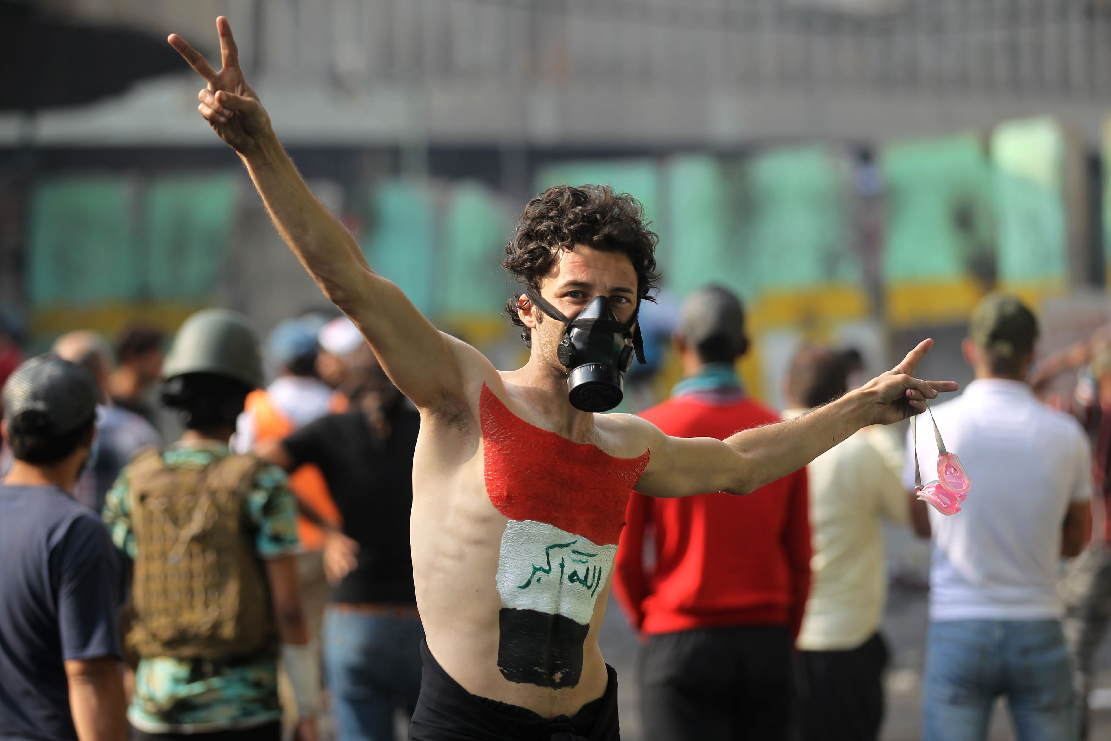 An Iraqi protester, a national flag painted on his chest, in Baghdad's Khallani square during ongoing anti-government demonstrations on Nov. 14, 2019 (Ahmad Al-Rubaye/AFP/Getty Images)