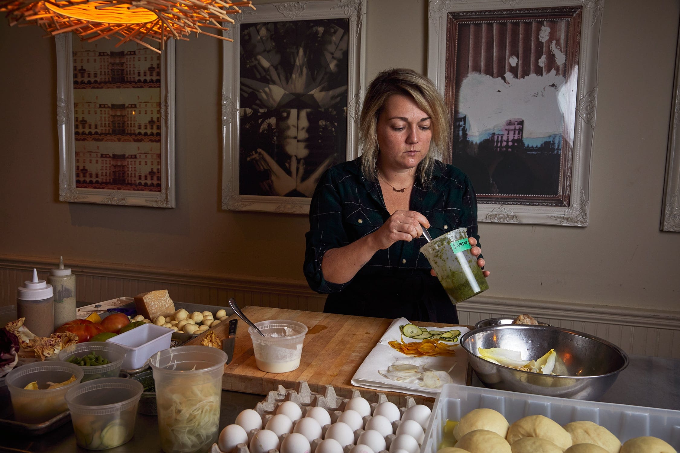 Chef Langley drizzles cannabis-infused oils onto dishes (Photograph by Christie Vuong)