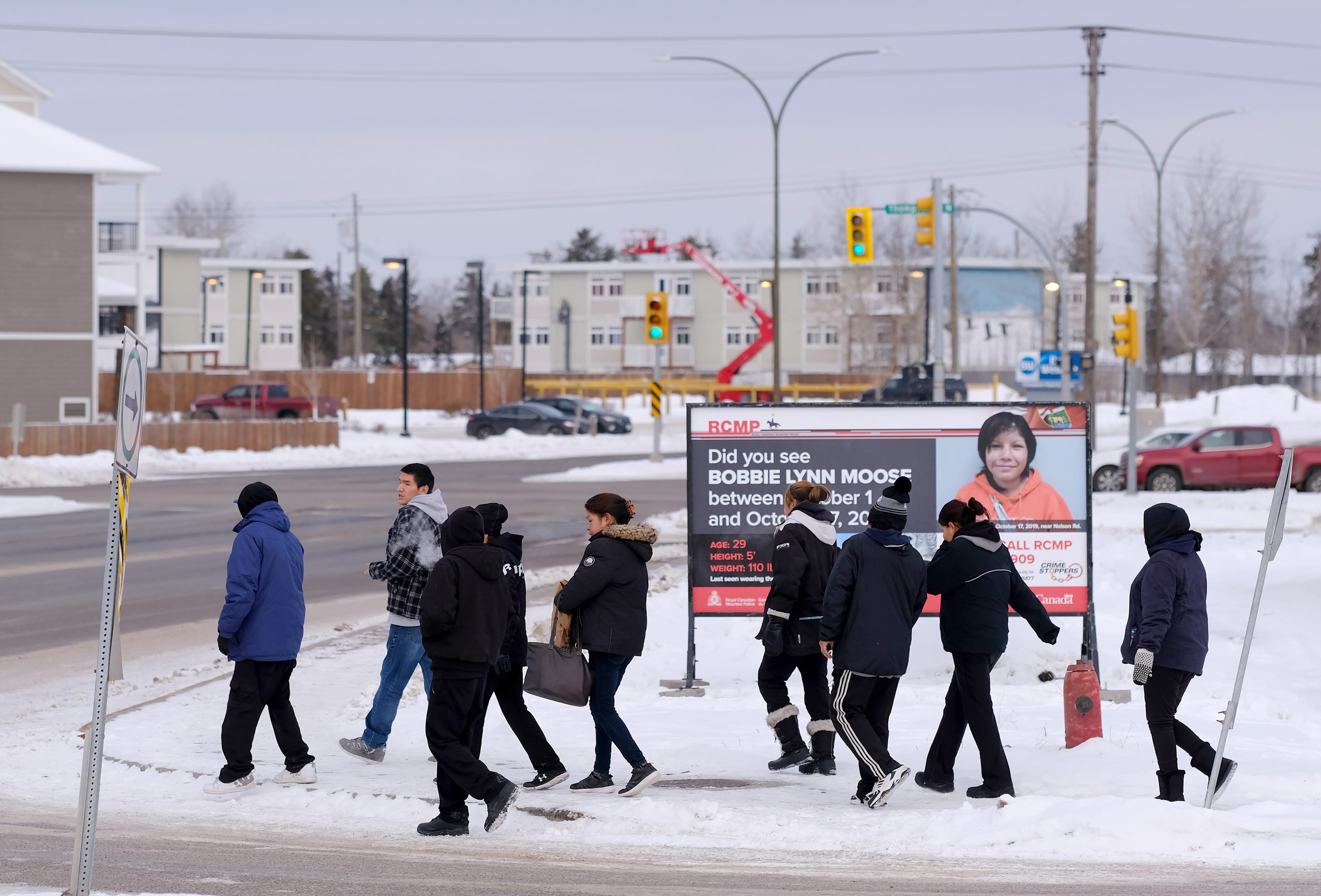 A billboard asking for information in the murder of Bobbie Lynn Moose sits near the city's liquor store. The 29-year-old mother of two was found murdered on the edge of the city centre this October. (Photo by Shannon VanRaes)