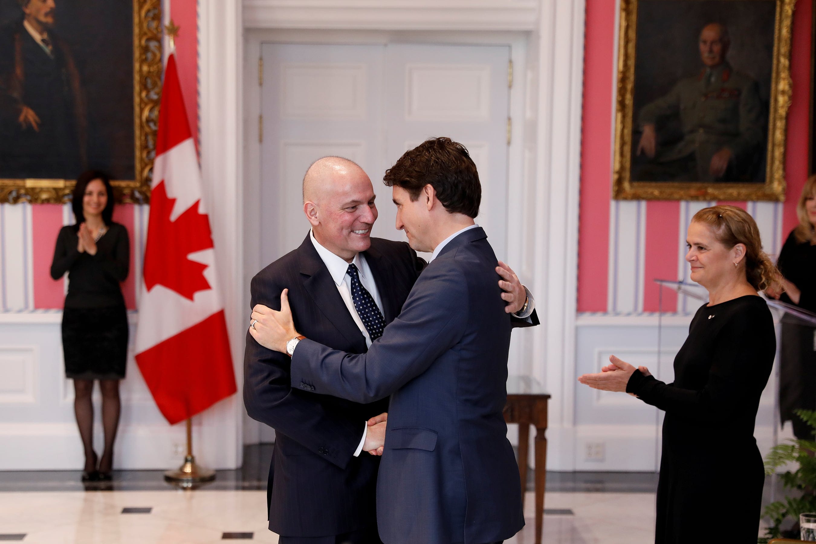 Dominic LeBlanc is embraced by Canada's Prime Minister Justin Trudeau after being sworn-in as President of the Queenís Privy Council for Canada during the presentation of Trudeau's new cabinet, at Rideau Hall in Ottawa, Ontario, Canada November 20, 2019. (Blair Gable/Reuters)