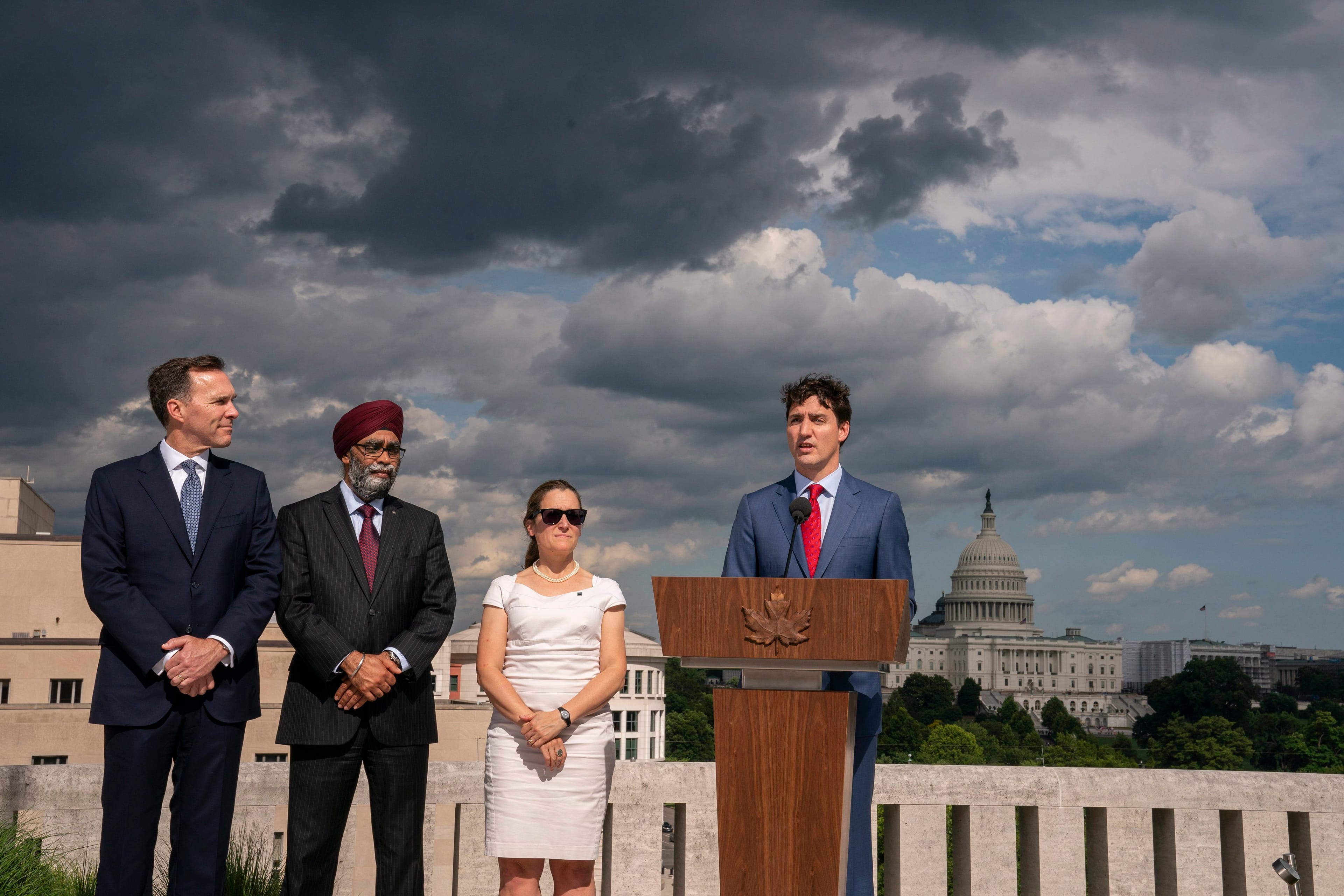 Trudeau speaks to reporters from the roof of the Canadian Embassy in Washington on June 20, 2019 (AP Photo/J. Scott Applewhite)