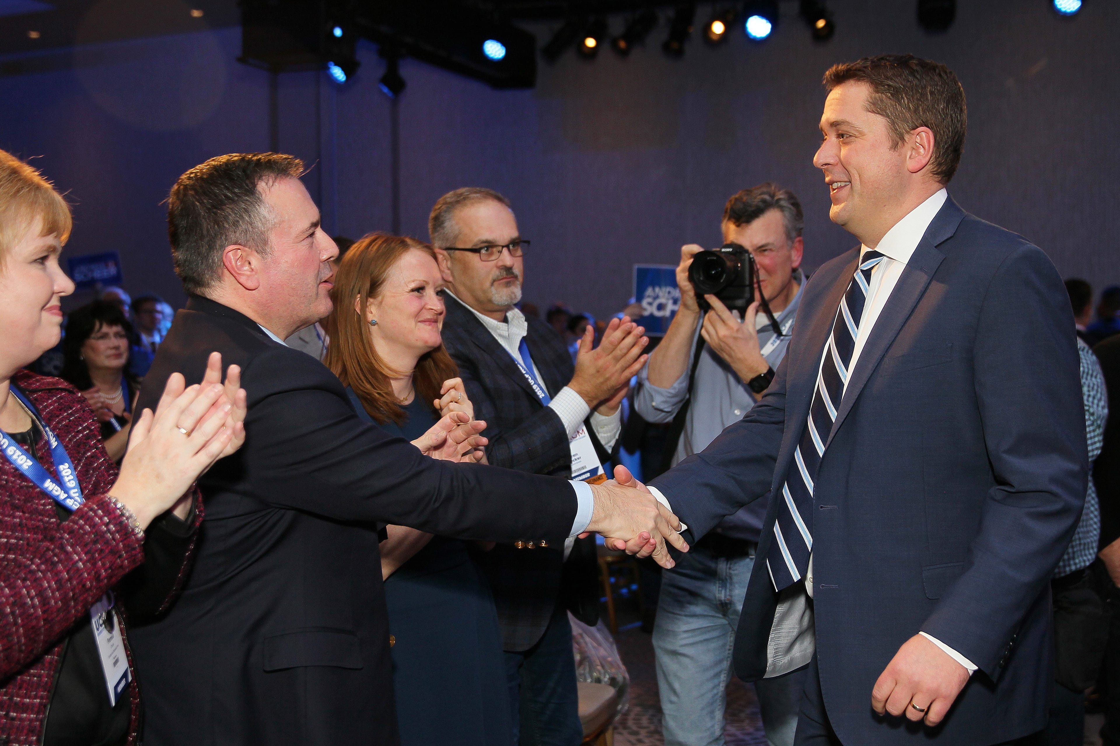 Scheer shakes hands with Kenney after his keynote speech at the Alberta United Conservative Party annual general meeting in Calgary on Nov. 29, 2019 (THE CANADIAN PRESS/Dave Chidley)
