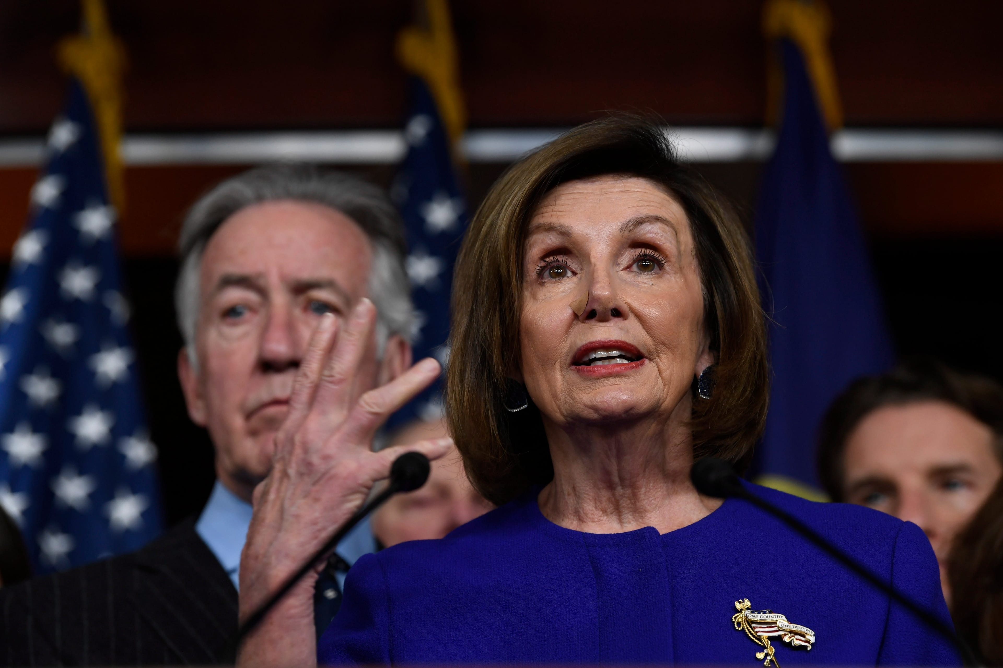 House Speaker Nancy Pelosi of Calif., accompanied by House Ways and Means Committee Chairman Richard Neal, D-Mass., speaks at a news conference on Capitol Hill in Washington, Tuesday, Dec. 10, 2019, on Capitol Hill in Washington. (AP Photo/Susan Walsh)