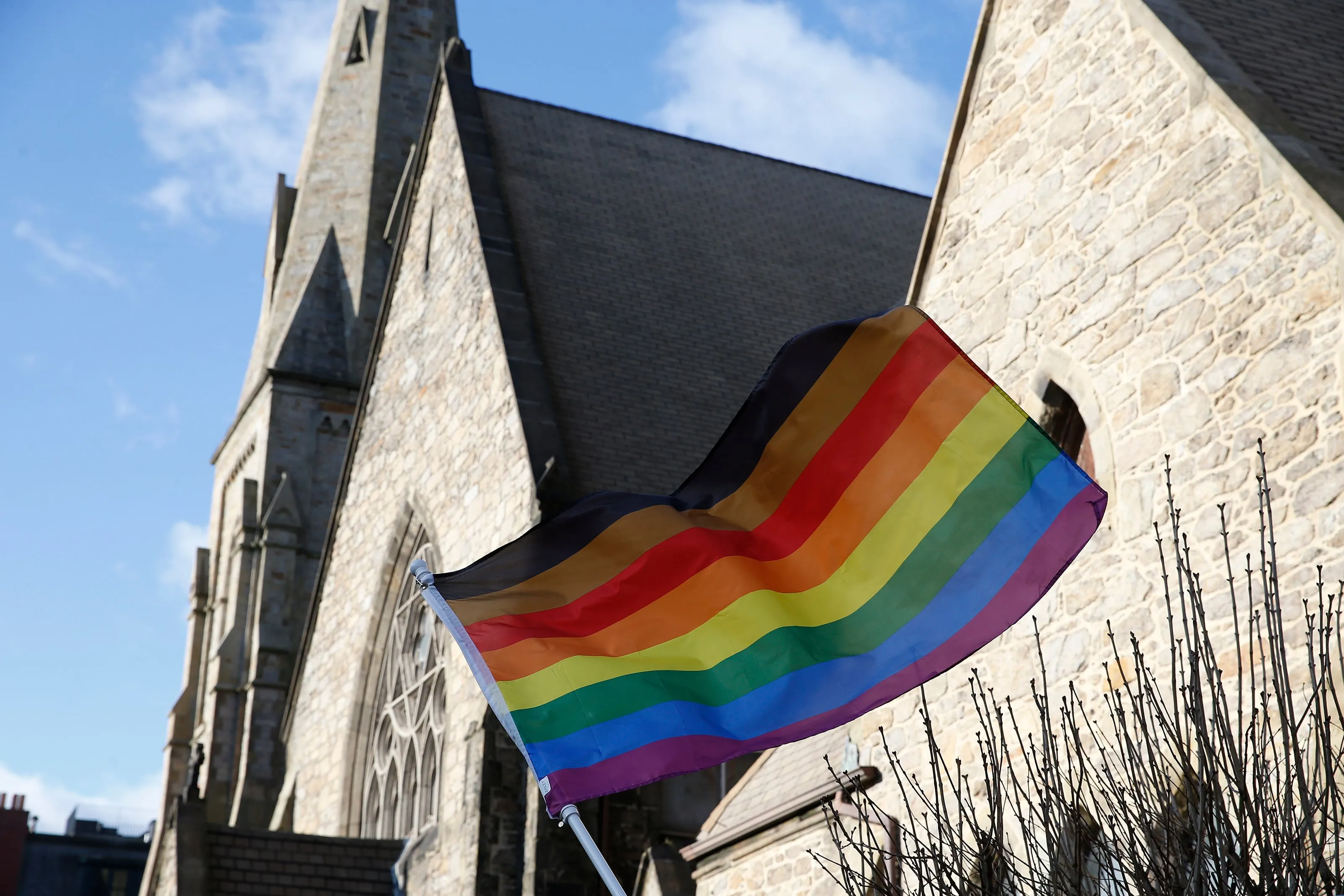 An LGBTQ flag flies over a methodist church in Boston on Jan. 5, 2020 (Jessica Rinaldi/The Boston Globe via Getty Images)